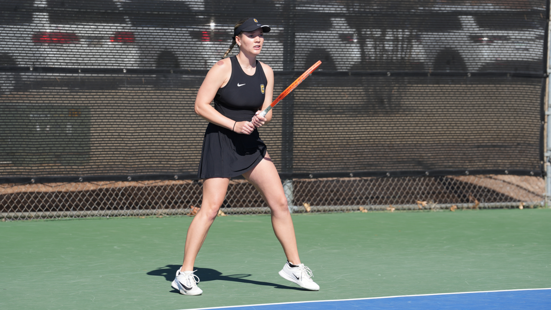Women's tennis player, Jenna Goessel, waiting to return a serve