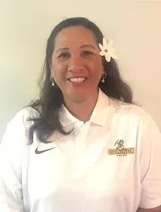 Danlynn Silva Head Volleyball Coach. White Cameron Polo and White Flower in Hair