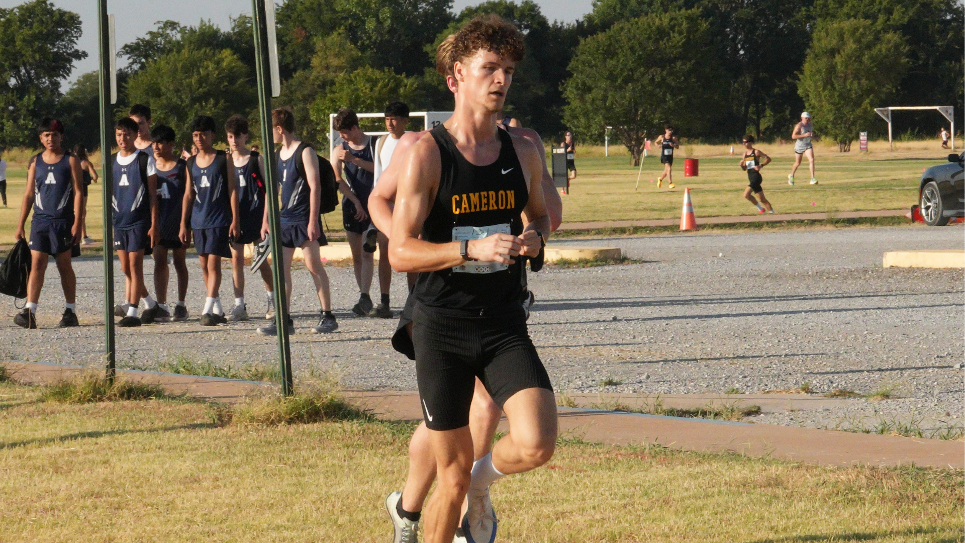 Cameron University men’s cross country runner competes on a grass course during the Mustang Derby in Wichita Falls, Texas.