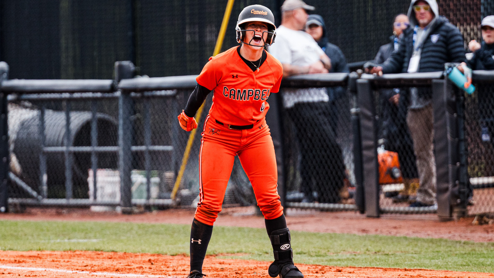 Madison Ford celebrates at first base