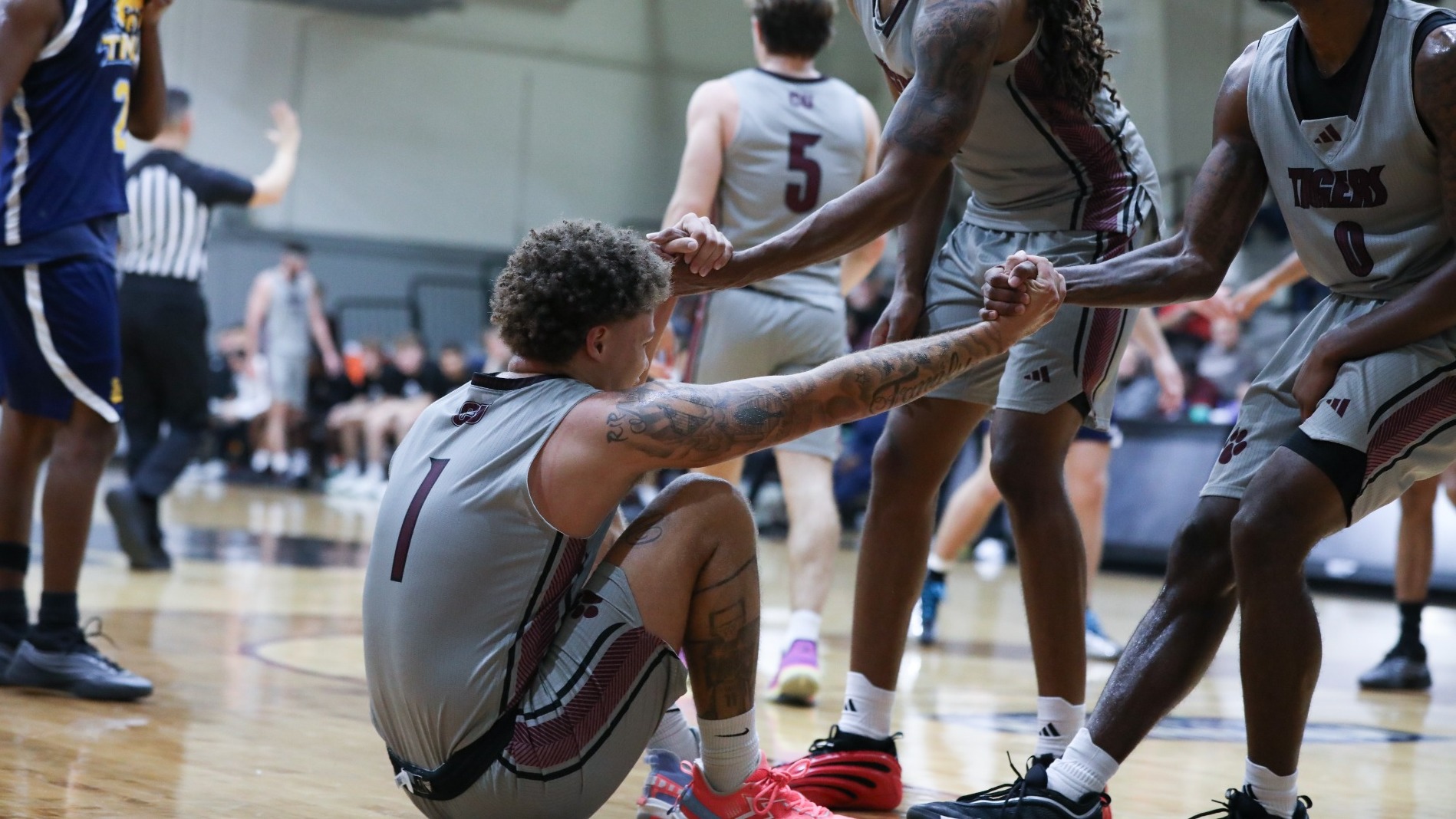 Vail helped up by teammates