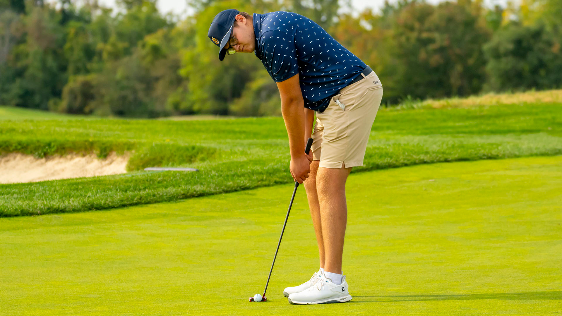 Alex Schickling lines up a putt at the 2024 Little Three Golf Championship at Crag Burn Gof Club in East Aurora, N.Y., on Sept. 17, 2024.