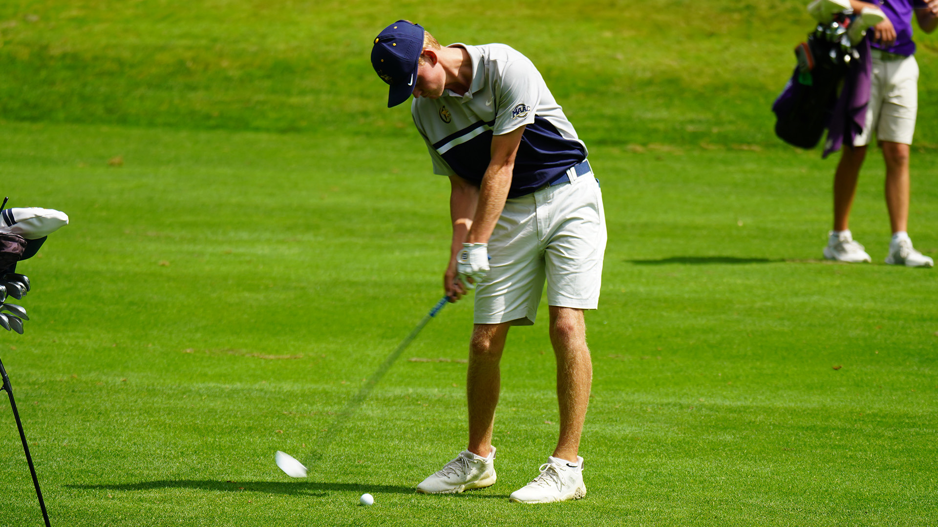 Mikey Takacs hits an approach shot from the fairway during the 2023 Little Three Championship in Olean, N.Y.