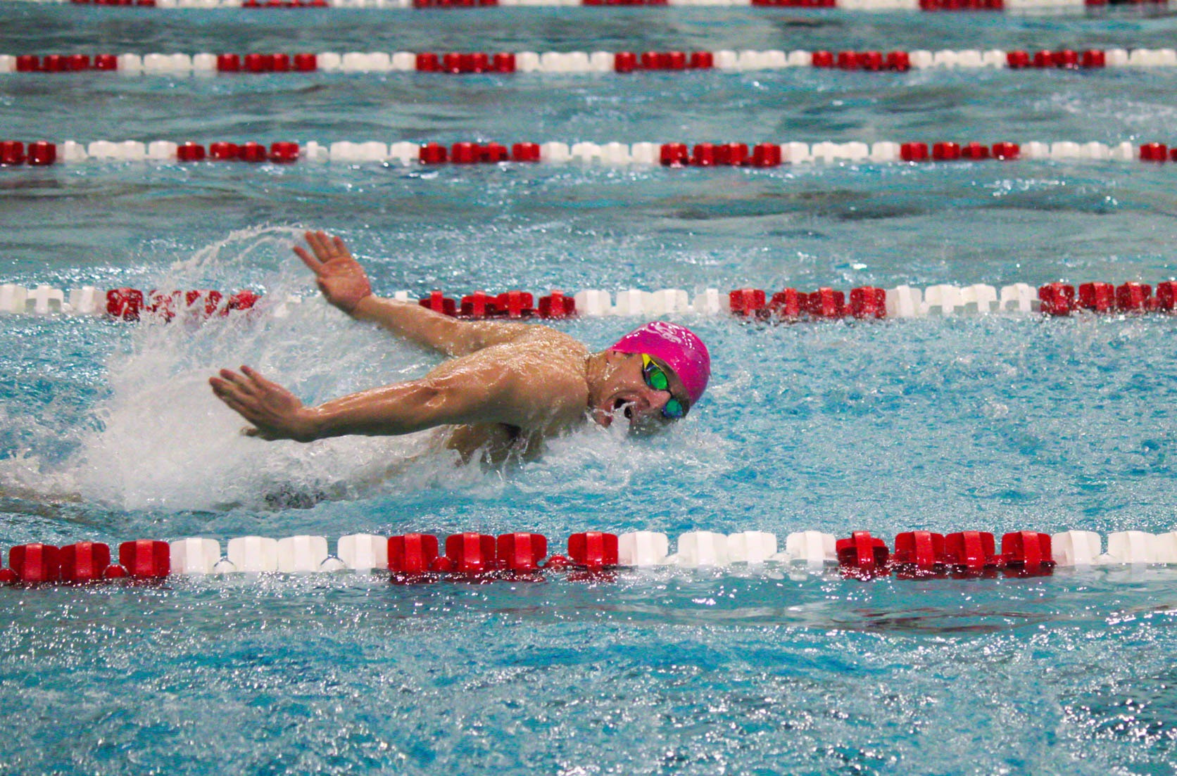 Giovanni Poggio swims the butterfly leg of the medley relay versus Le Moyne