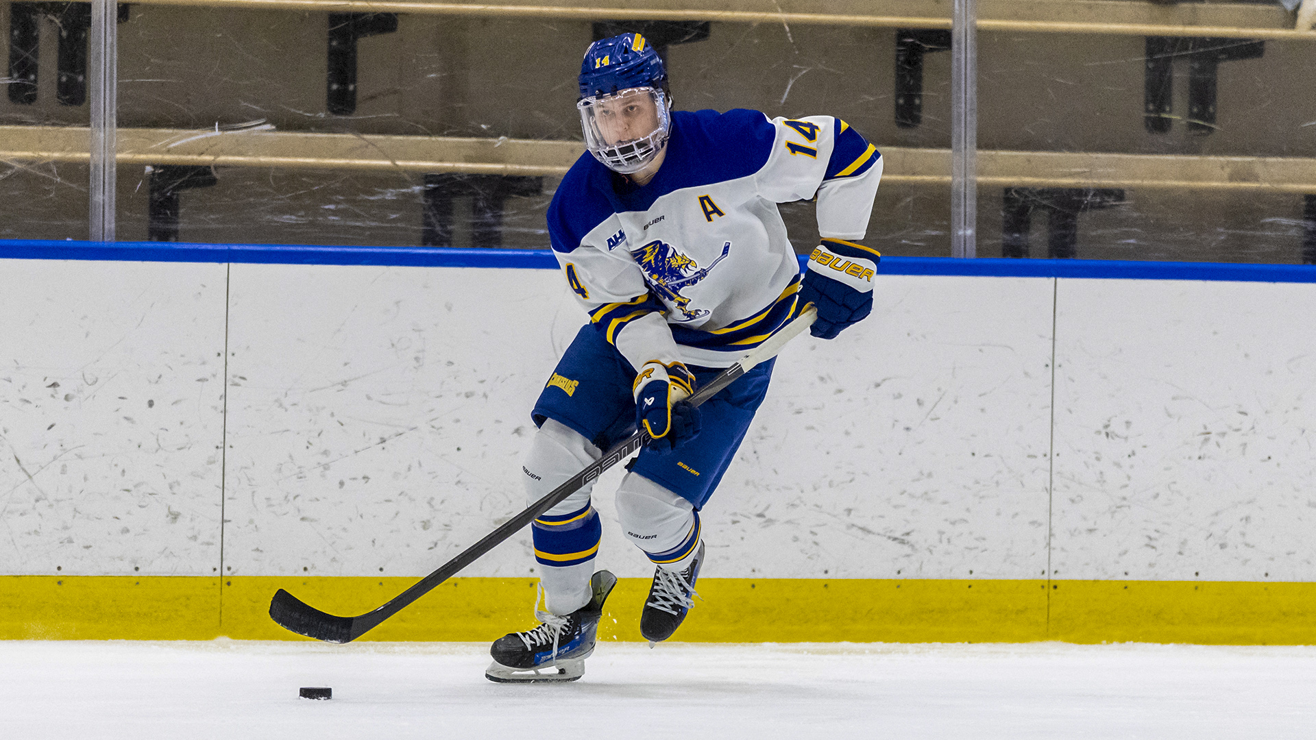 Trey Funk Cole Miller is shown skating with the puck in game action versus St. Lawrence at LECOM harborcenter on Oct. 10, 2025