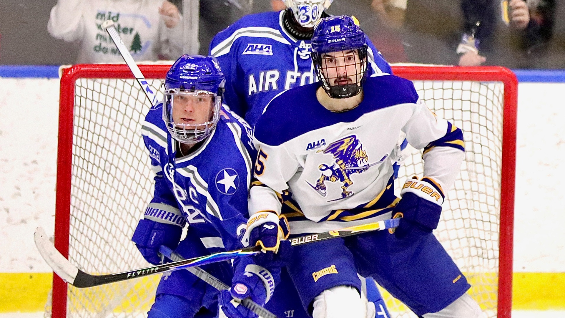Canisius forward Cole Miller does battle with Air Force's Chris Hedden during game action at LECOM Harborcenter on Nov. 28, 2025