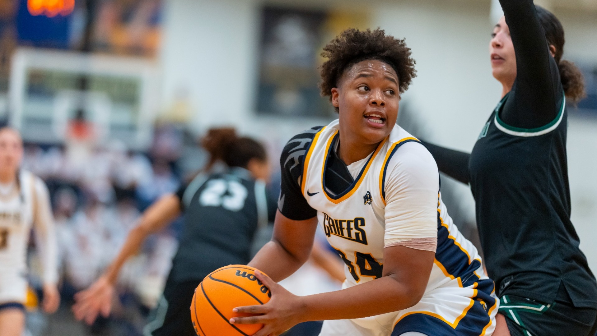 Shariah Gailes holds off a defender vs Eastern Michigan at the Koessler Athletic Center on November 7th 2025