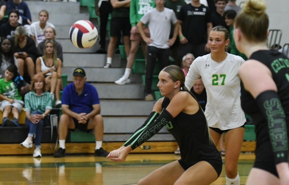 Cali Tierney hits a ball in her high school game.