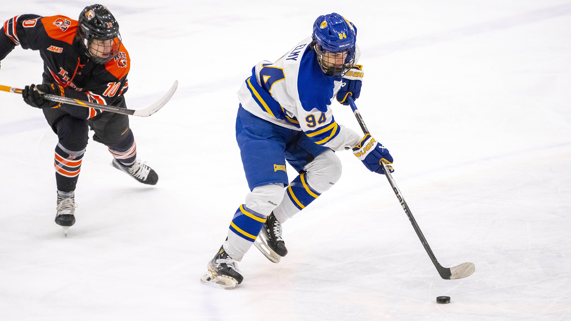 Canisius forward David Elmy is shown skating with the puck during game action versus RIT at LECOM Harborcenter on Dec. 6, 2025
