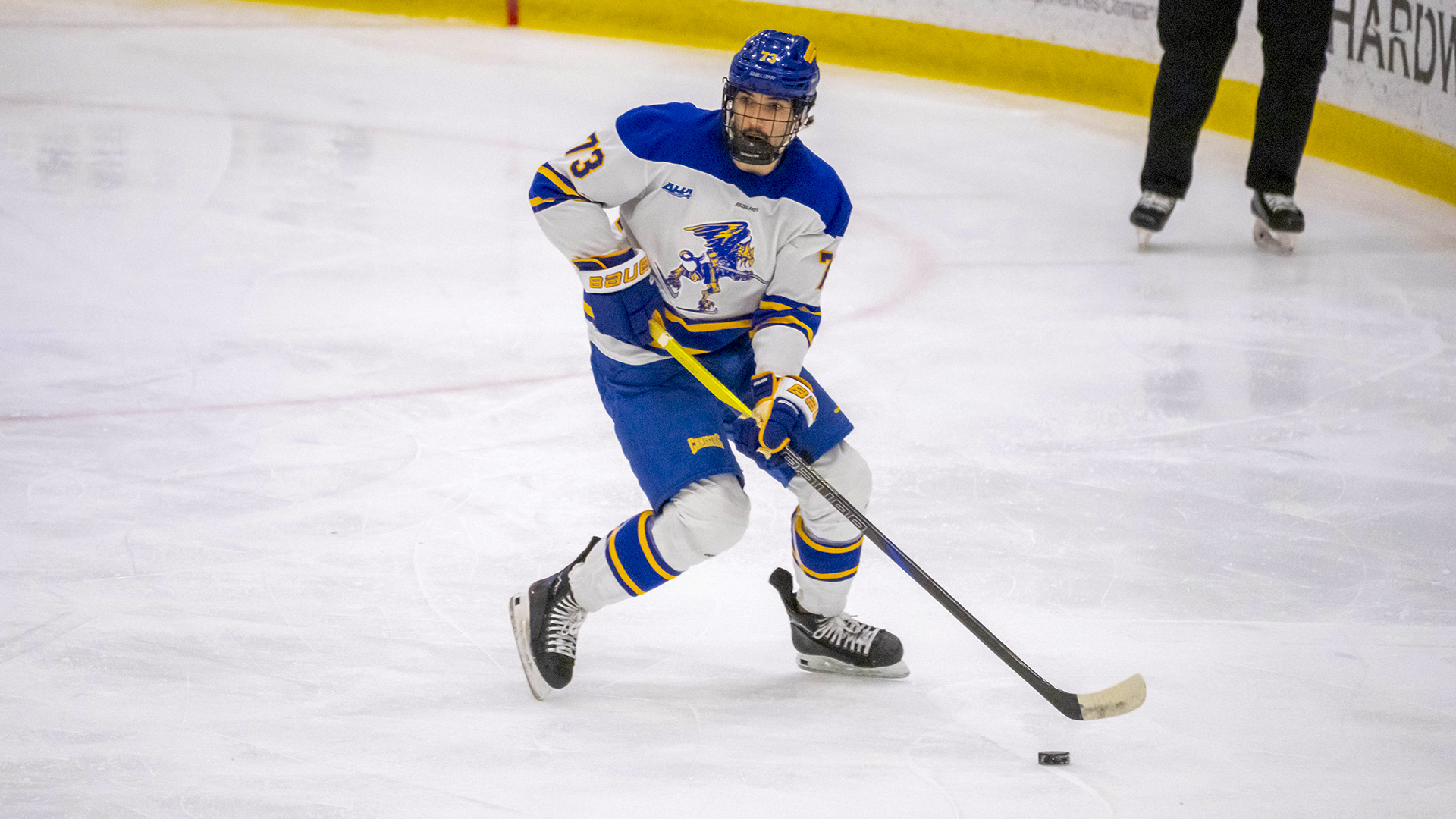 Canisius defenseman FJ Buteau is shown skating with the puck during game action versus RIT at LECOM Harborcenter on Dec. 6, 2025