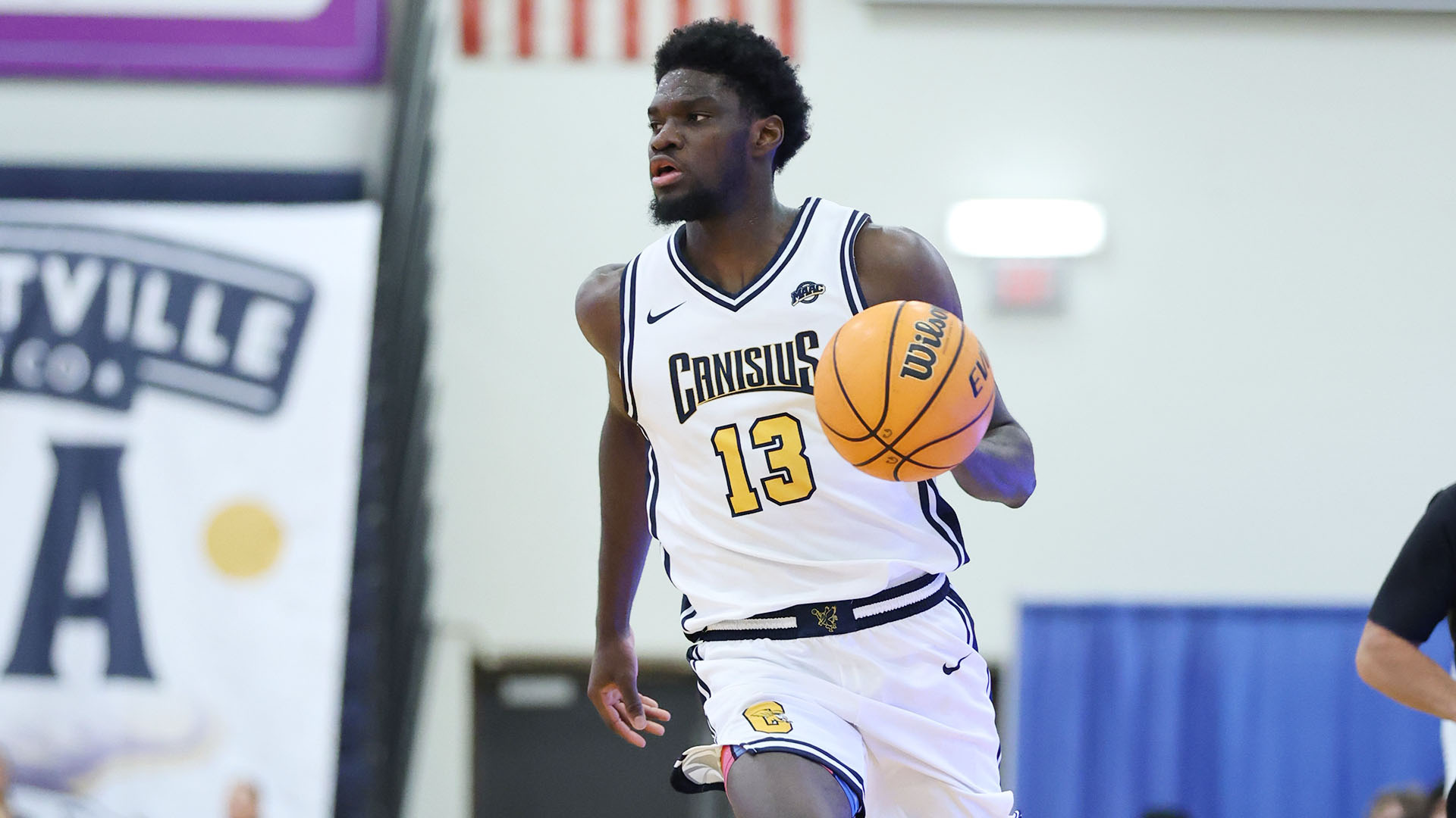 Bryan Ndjonga brings the ball up the floor in the first half of a home game against Buffalo Nov. 29, 2025.