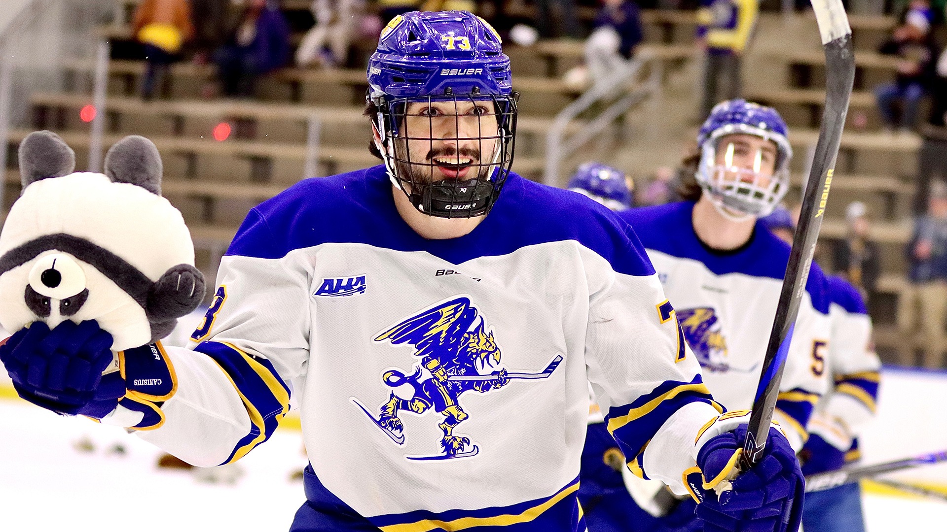 Canisius defenseman FJ Buteau skates to the bench with a friend after scoring the opening goal in the Griffs 4-2 victory versus RIT at LECOM Harborcenter on Dec. 6, 2025
