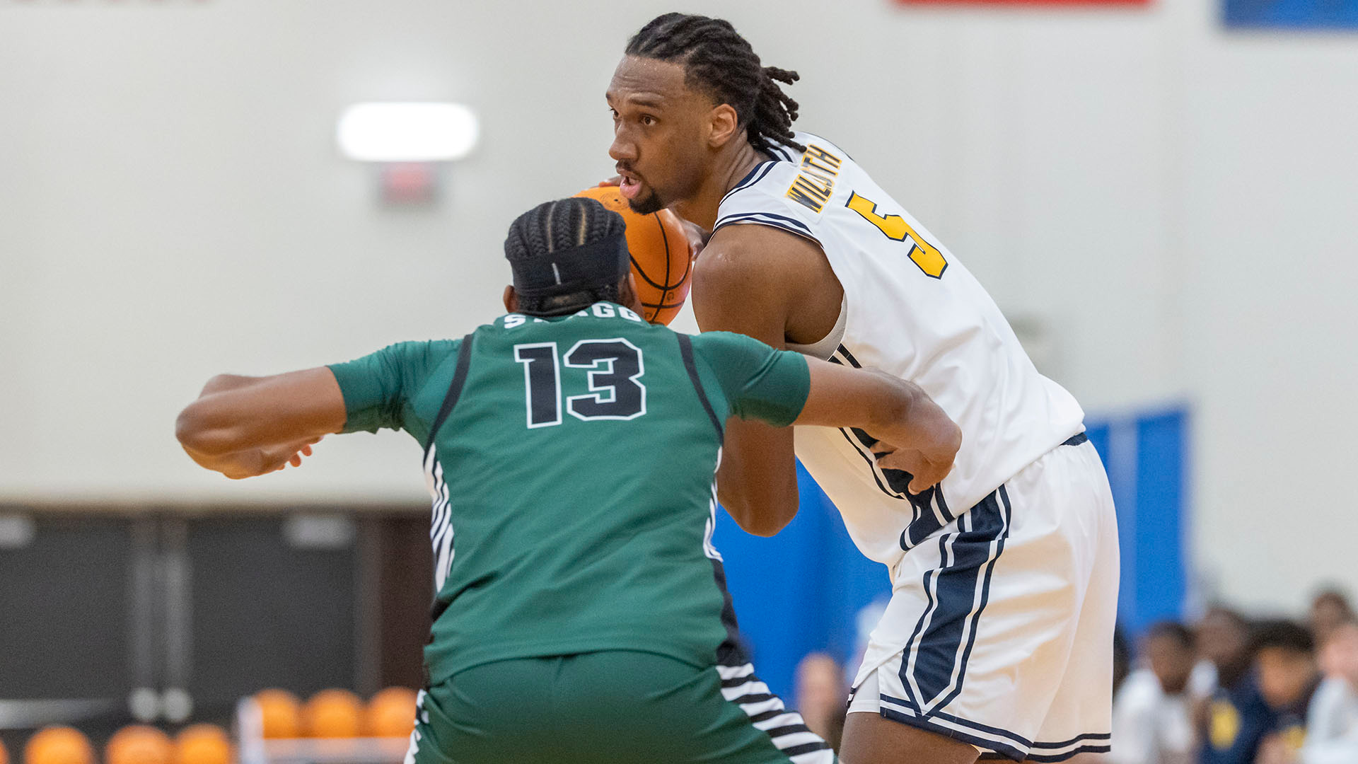 Myles Wilmoth looks to make a pass from the high post in the team's home victory over Binghamton on Nov. 23, 2025.