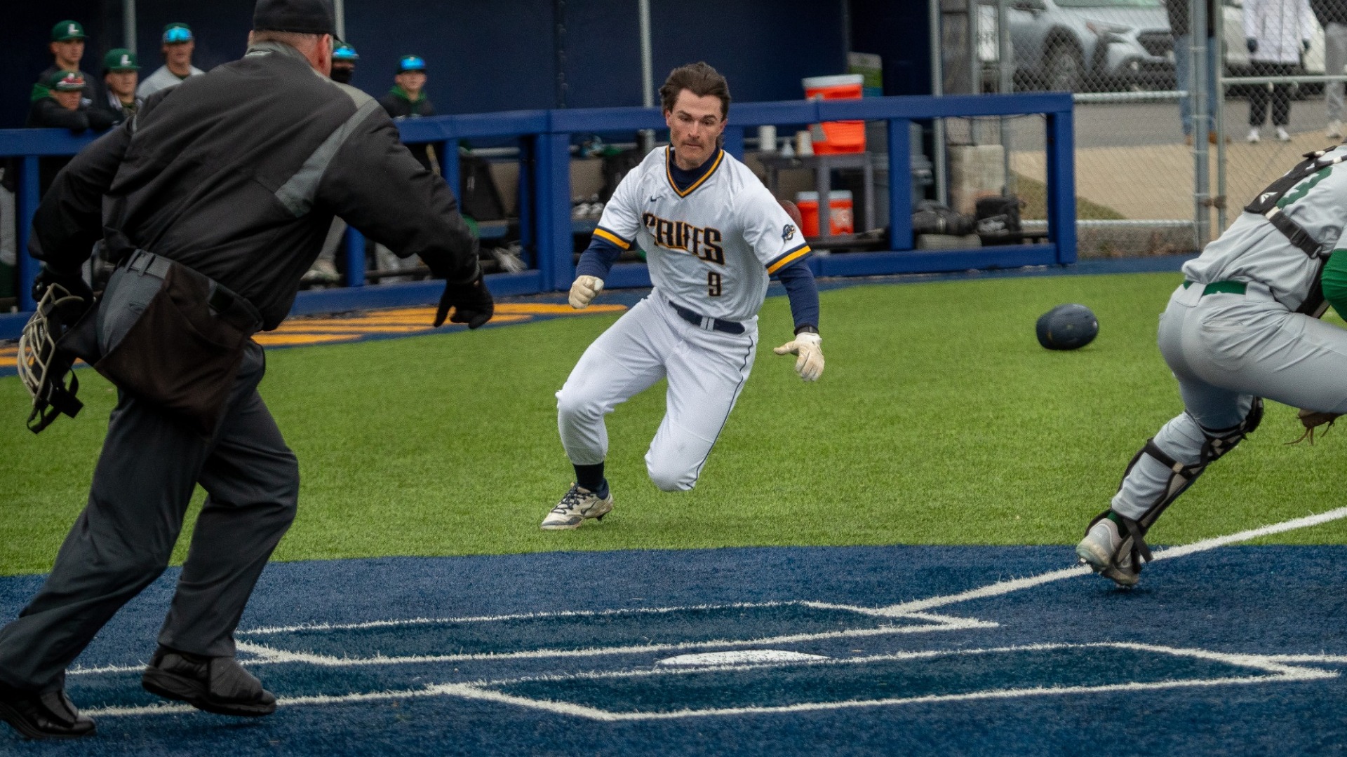 Owen Silliman slide into home at the Demske Sports complex against Le Moyne on March 25, 2025