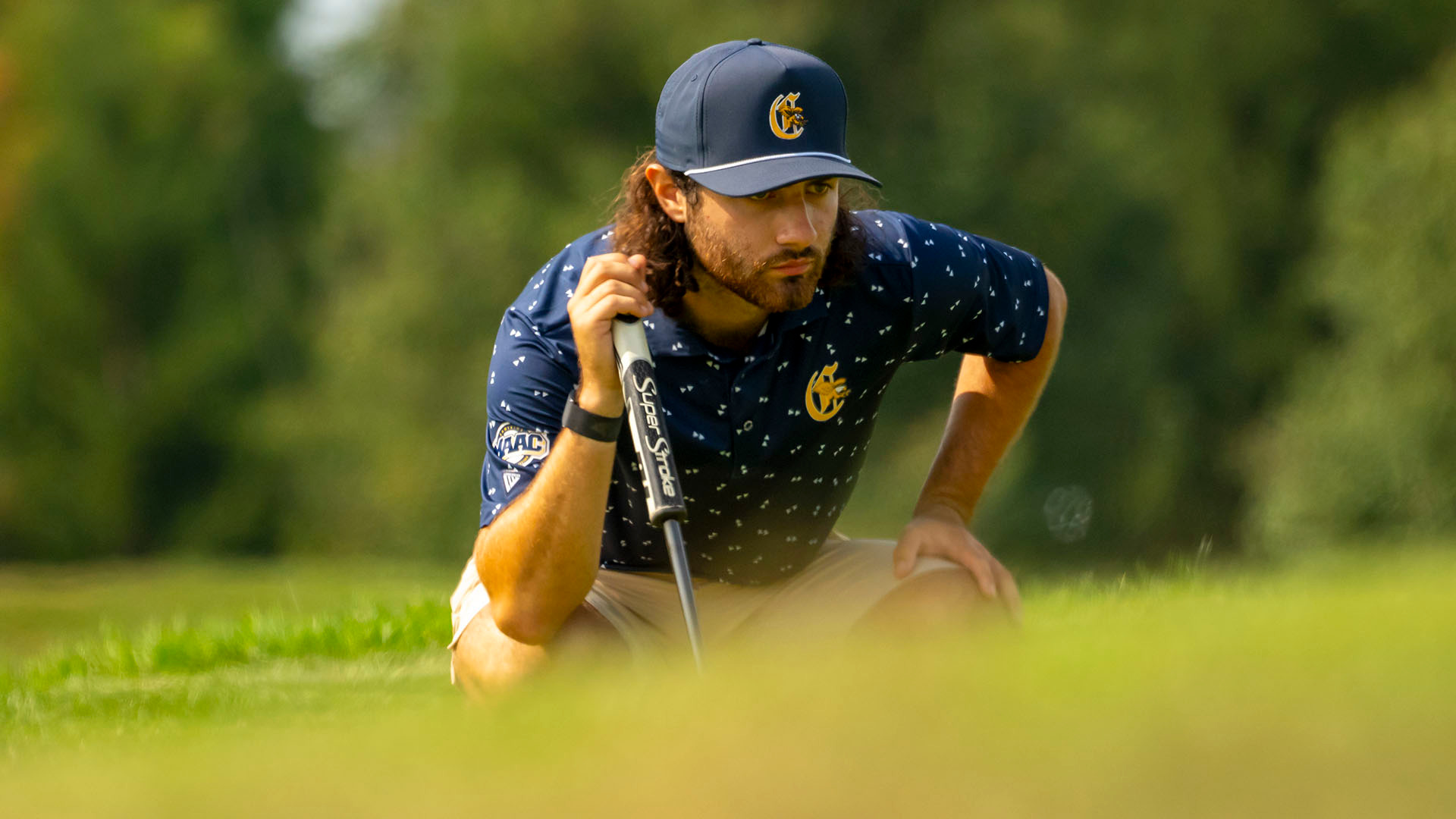 Jake Dantonio lines up a putt during the first round of the 2024 Little Three Championship at Crag Burn Golf Club in East Aurora, N.Y.