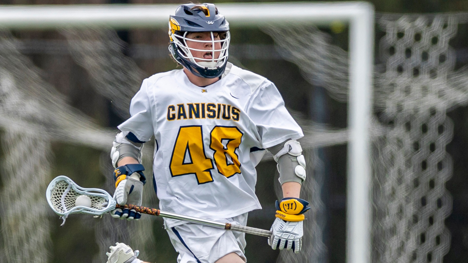 Canisius face-off specialist Micah Hanson is shown running with the ball during game action versus Manhattan at the Demske Sports Complex on March 29, 2025