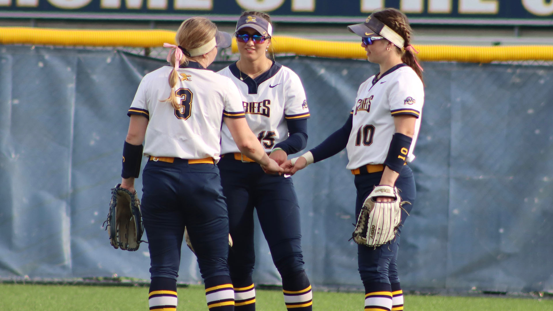 Canisius outfielders Alyssa Cloutier, Tabitha von Kolen and Ella Johel talk before the start of an inning during a home game against Rider on April 4, 2025.
