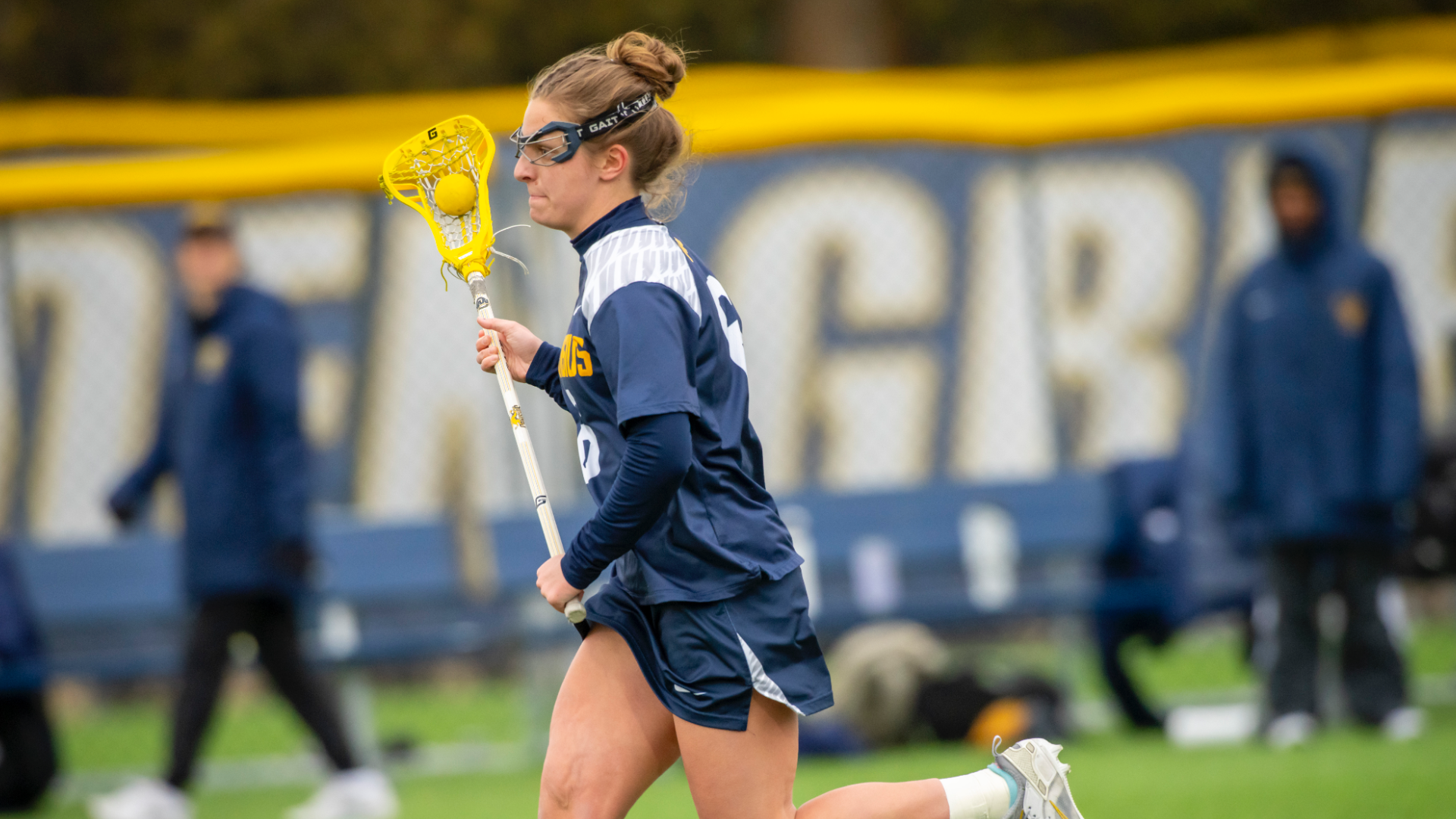 Maddie Fitzgerald strides down the field with the ball cradling it on an ever important possession in a neck and neck battle against the Central Michigan Chippewas on a cold Wednesday afternoon (March 12th) at the Demske Sports Complex in Buffalo, N.Y.