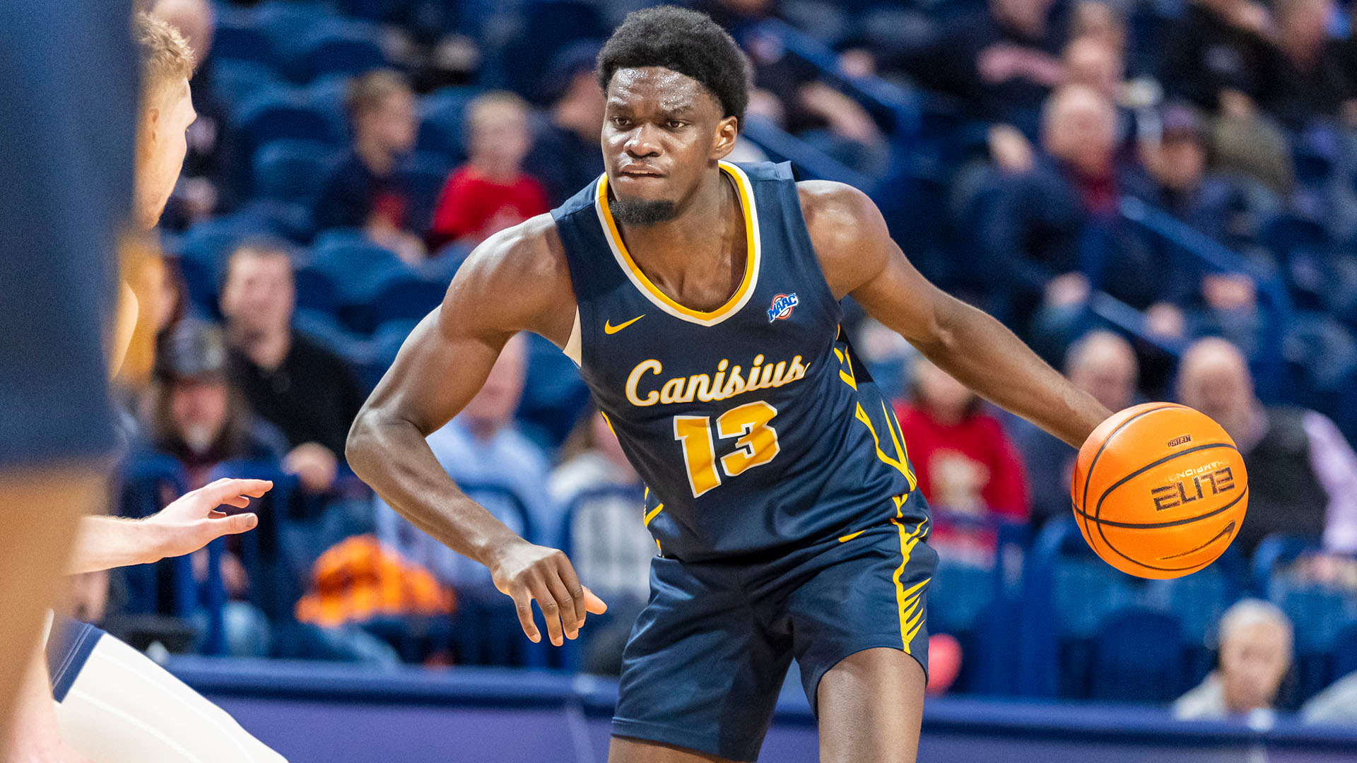 Bryan Ndjonga makes a move toward the basket in a road game at Duquesne on Dec. 22, 2025.