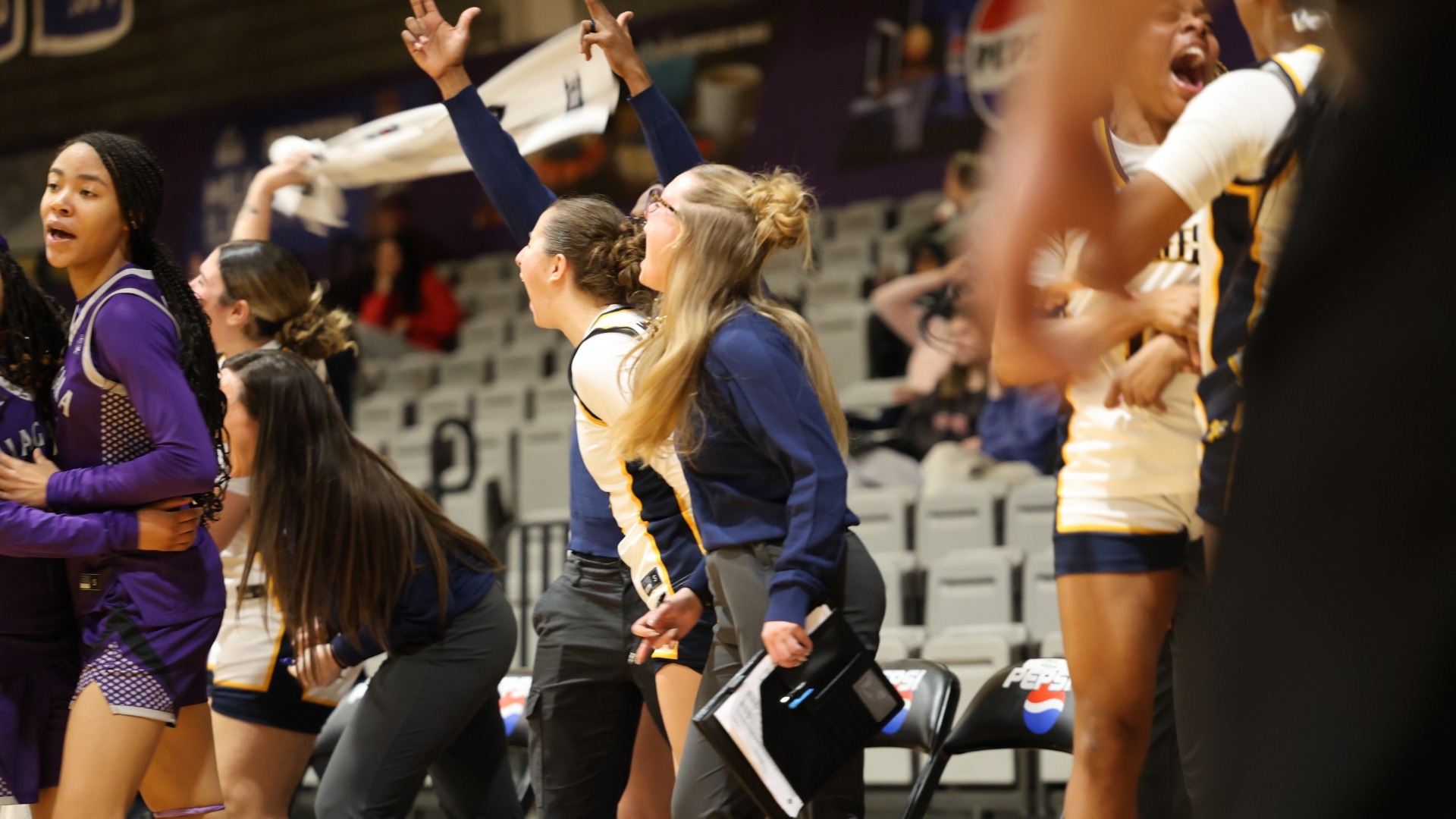 Canisius bench celebrates a three pointer from mary copple at the Gallagher Center in Lewiston, N.Y.