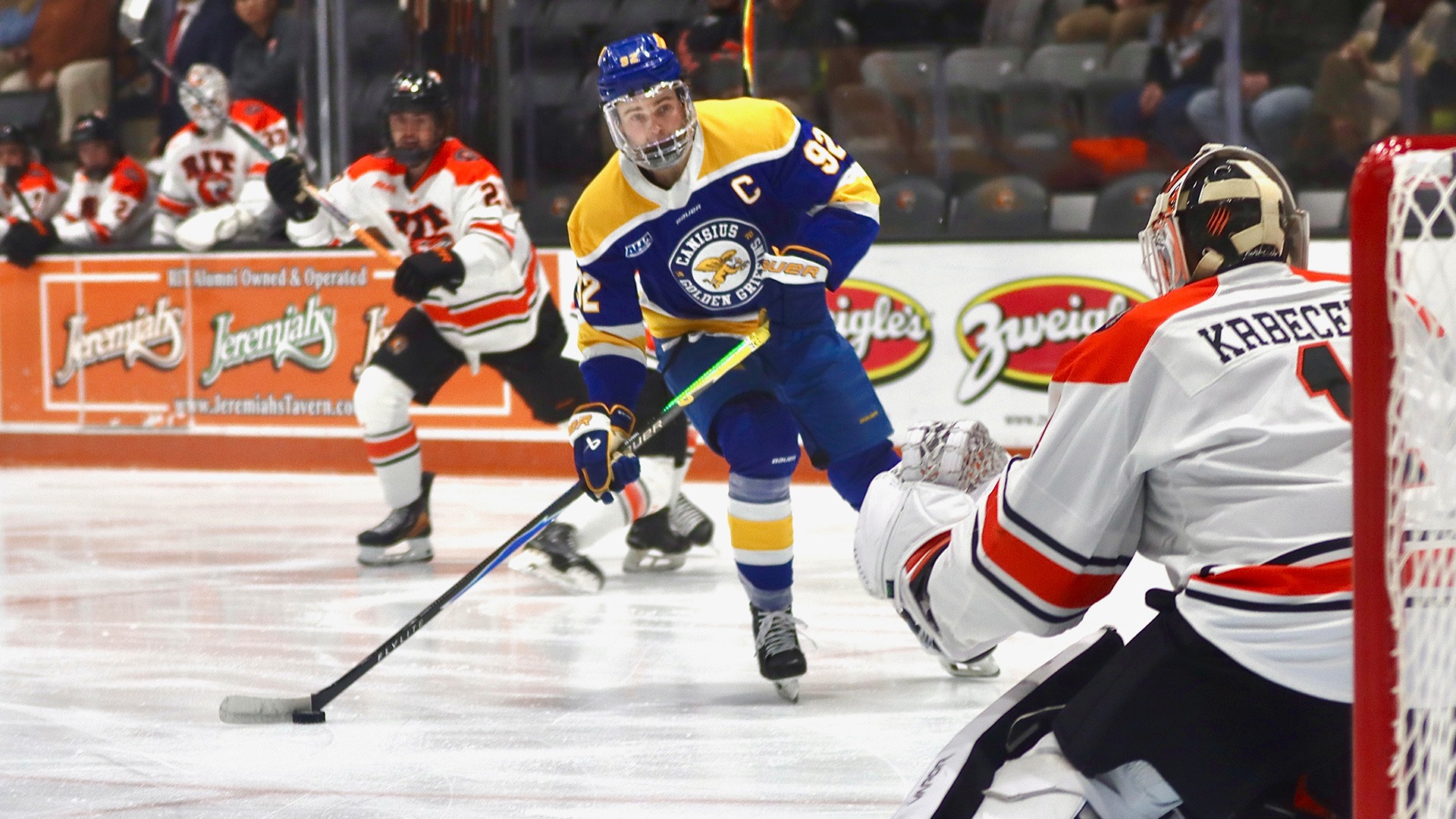 Canisius forward Oliver Tarr looks to shoot the puck on RIT goaltender Jakub Krbecek during game action at the Gene Polisseni Center in Rochester on Jan. 17, 2026