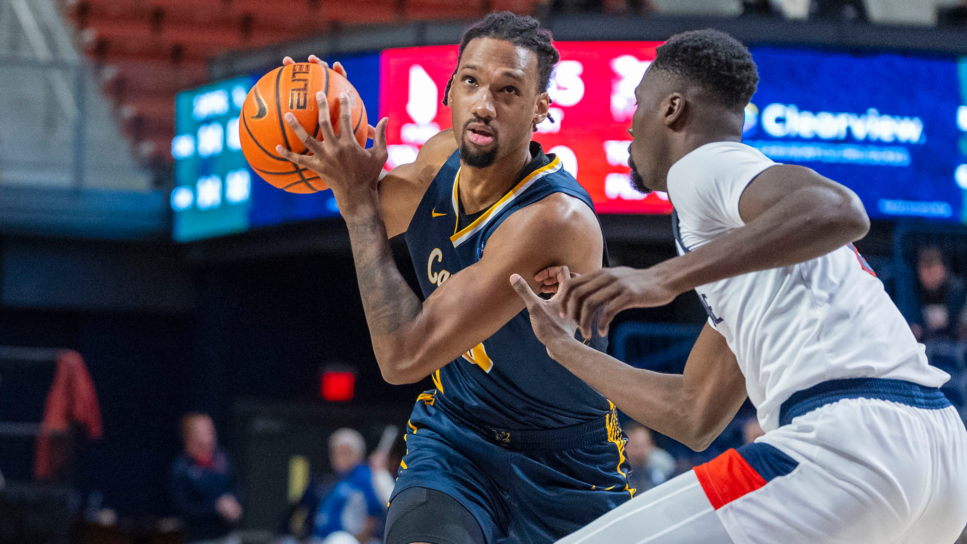Myles Wilmoth looks to make a pass in the second half of a road game at Duquesne on Dec. 22, 2025.