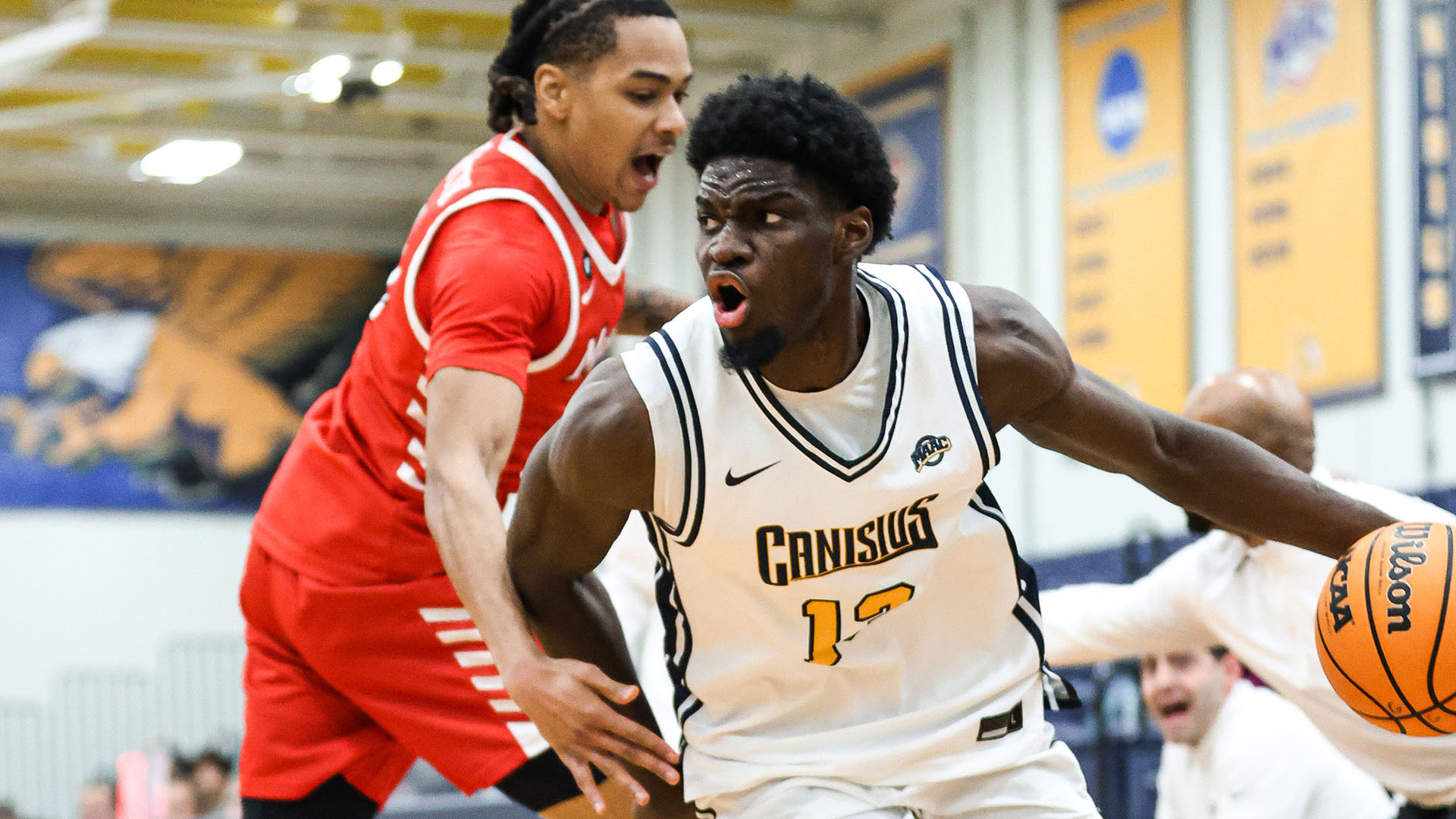 Bryan Ndjonga drives baseline and scores in a home game against Marist on Jan. 30, 2026.