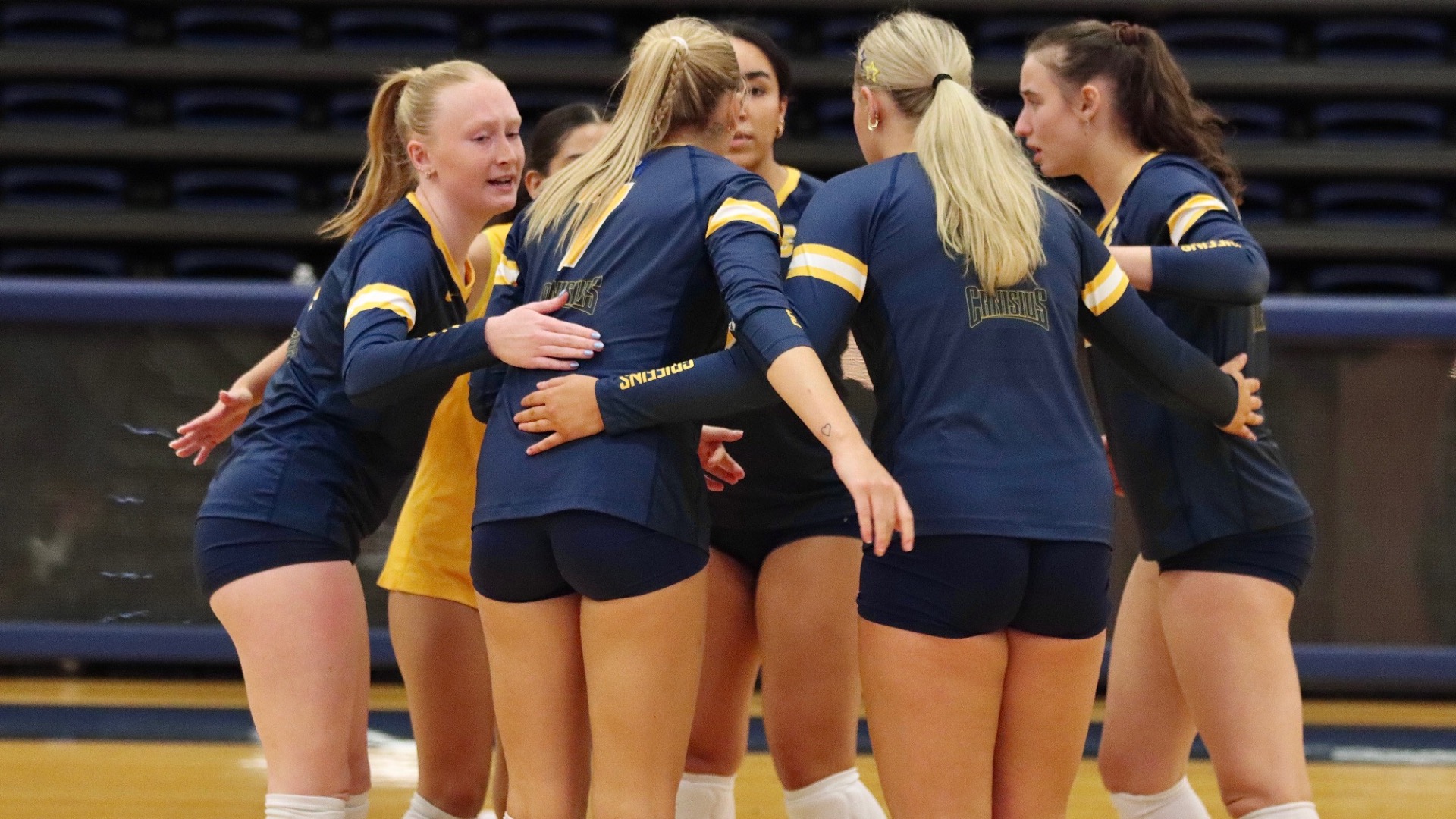 Team huddles before a point against Dartmouth