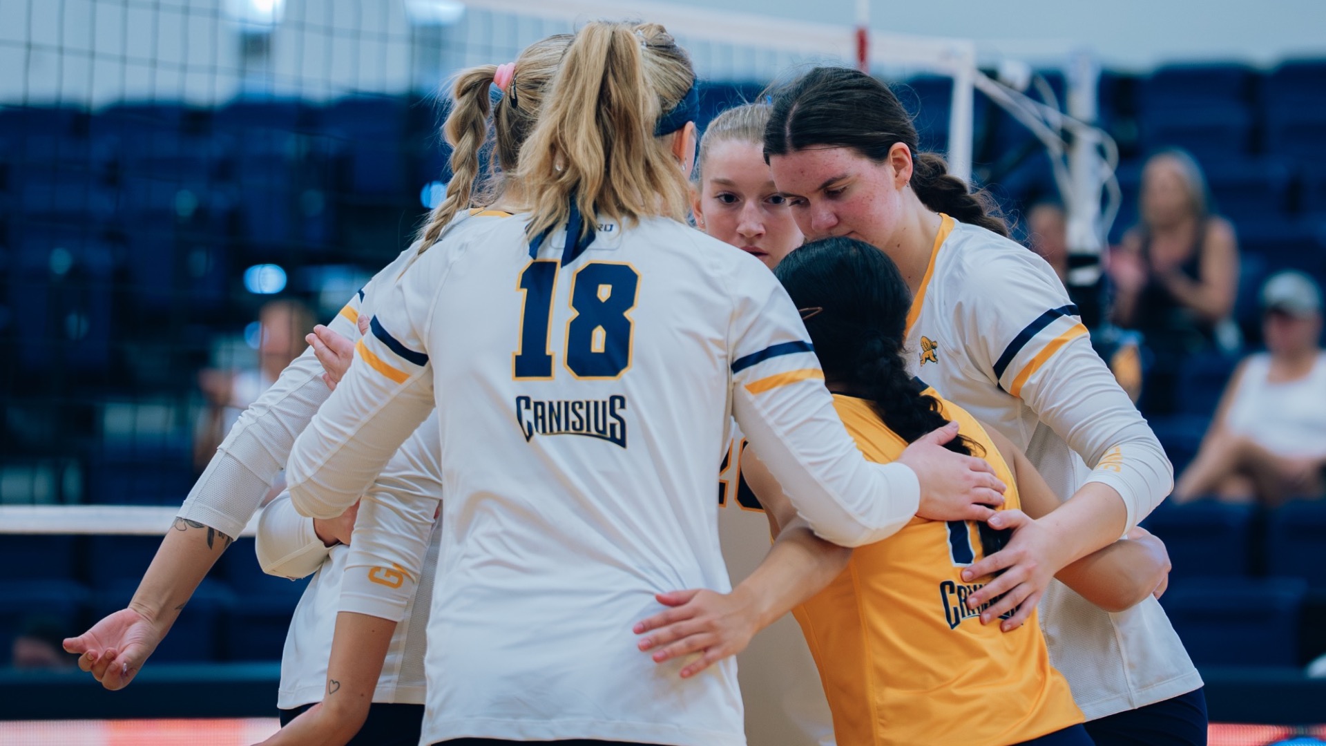 Team huddles after point against UMBC