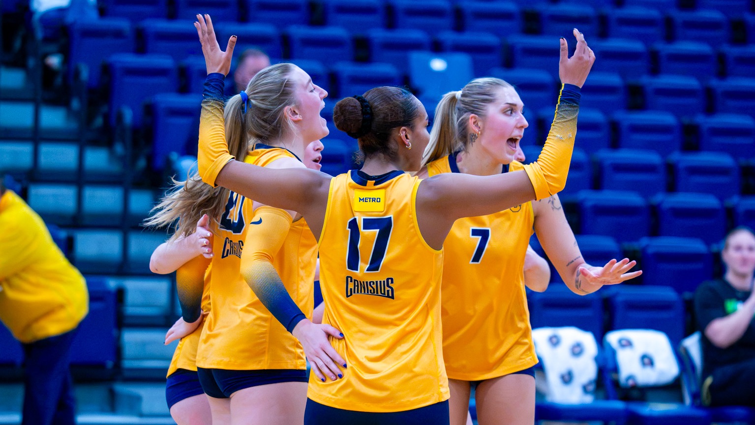 Team Celebrates a Point Against Quinnipiac in the Second Set