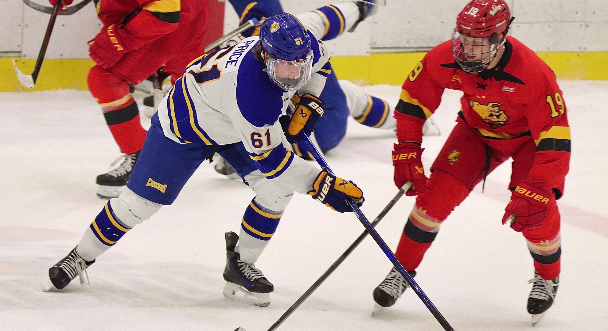 Canisius forward Hunter Price and Ferris State's Nathan Leek battle for the puck during game action at LECOM Harborcenter on Oct. 3, 2026
