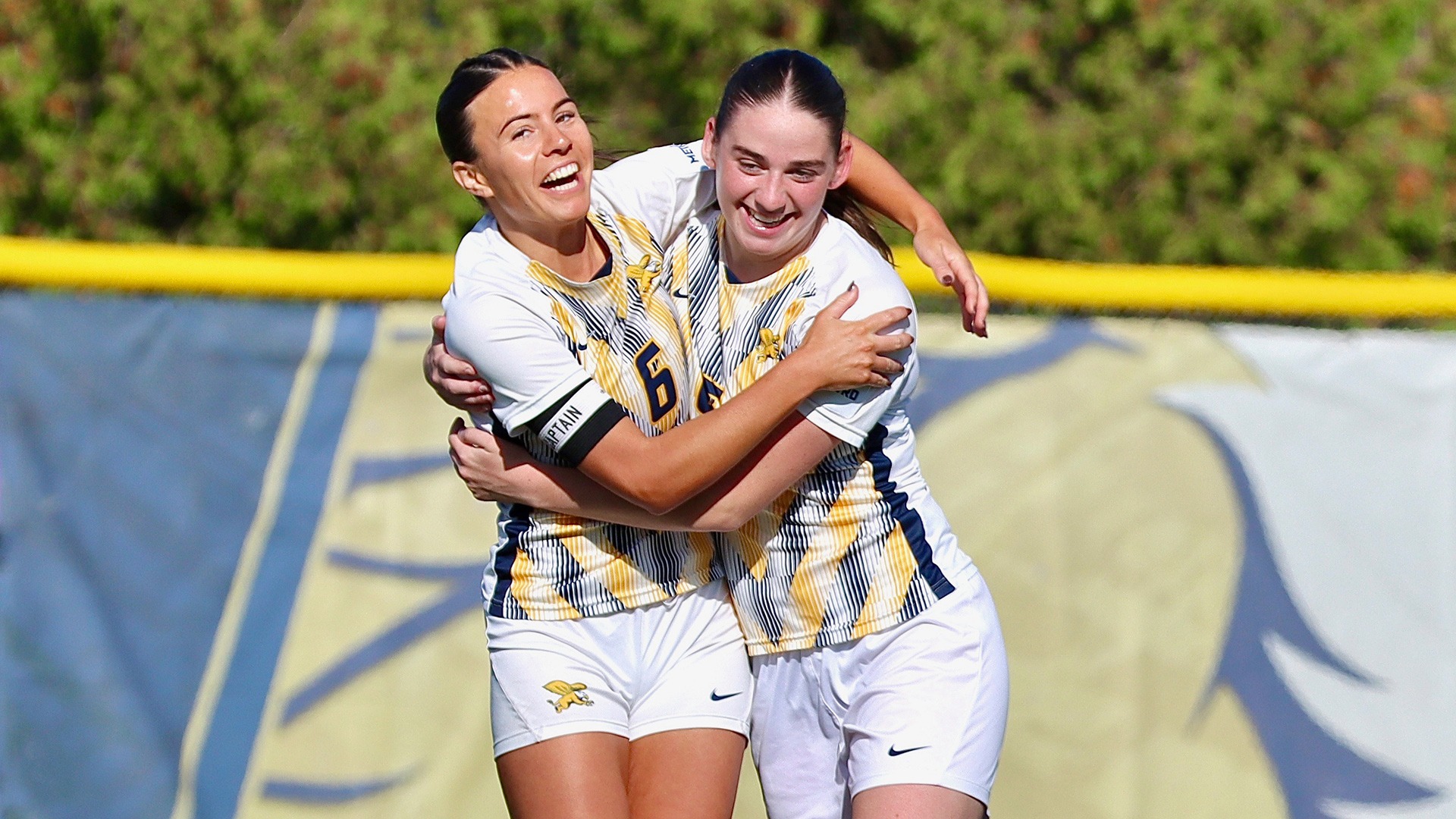 Emilia Nuttall (left) and Jessica Whitaker celebrate after Nuttall's goal versus Manhattan at the Demske Sports Complex on Oct. 31, 2026