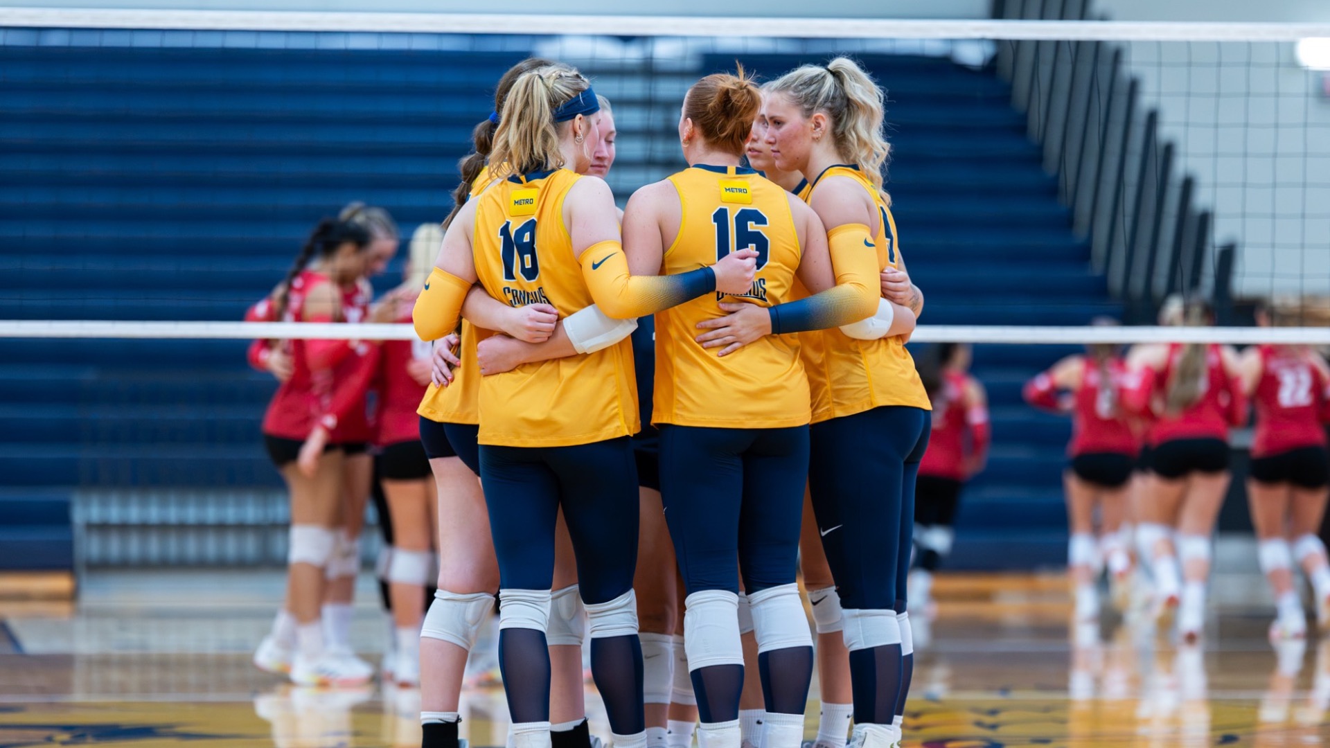 Team huddles after a point against sacred heart