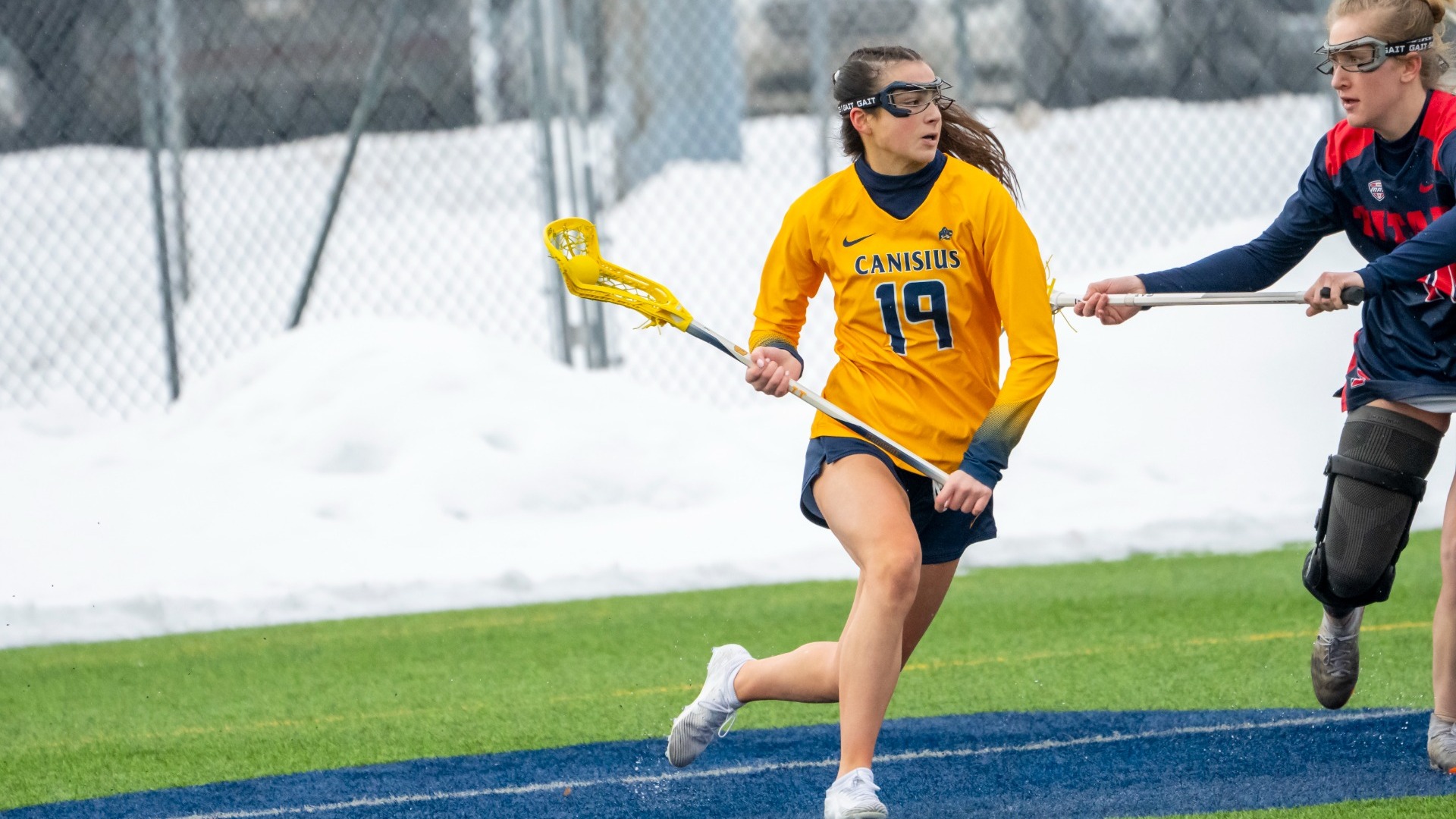 Ella Forcucci battles a defender vs Detroit Mercy at the Demske Sports Complex in Buffalo, N.Y.