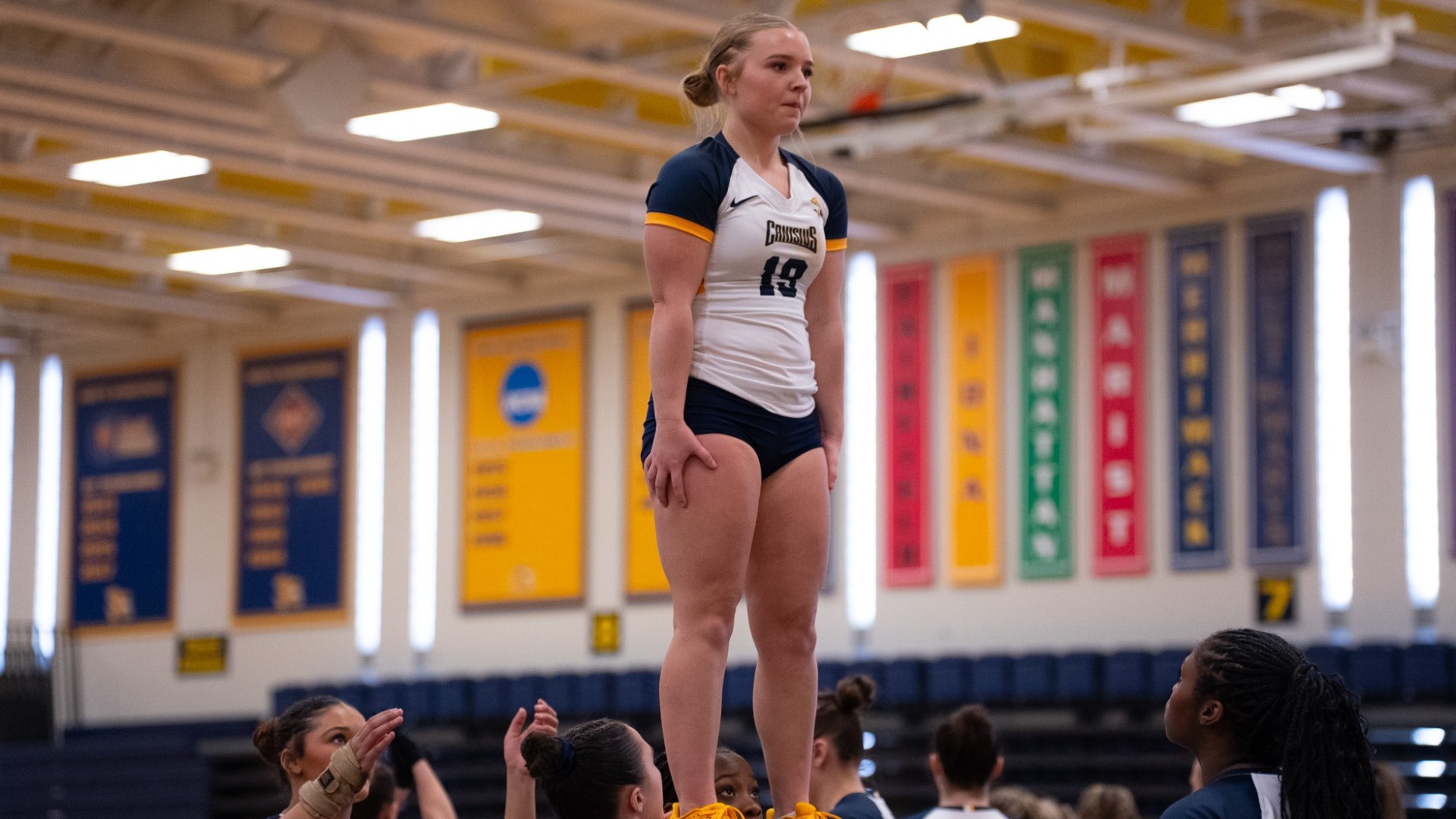 Jenna Orient gets held in the air by teammates at the Koessler Athletic Center.