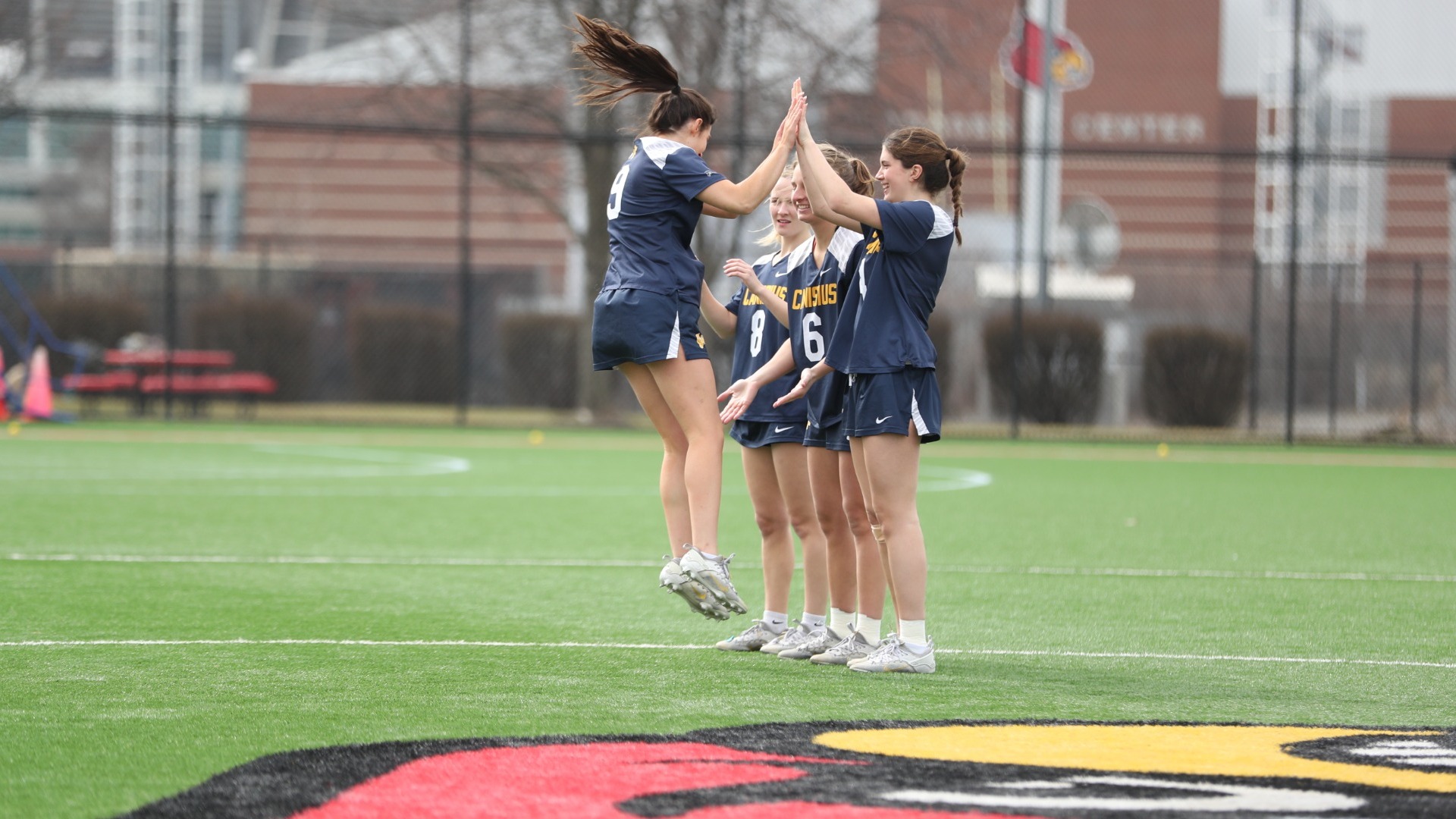 Maggie Tifft celebrates during starting lineups at Louisville.