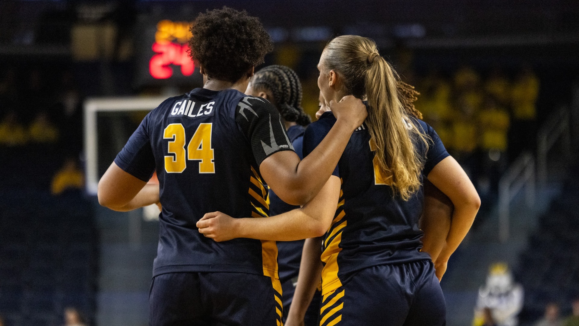 Team huddles vs michigan on november 3rd 2025 at the Crisler Center.