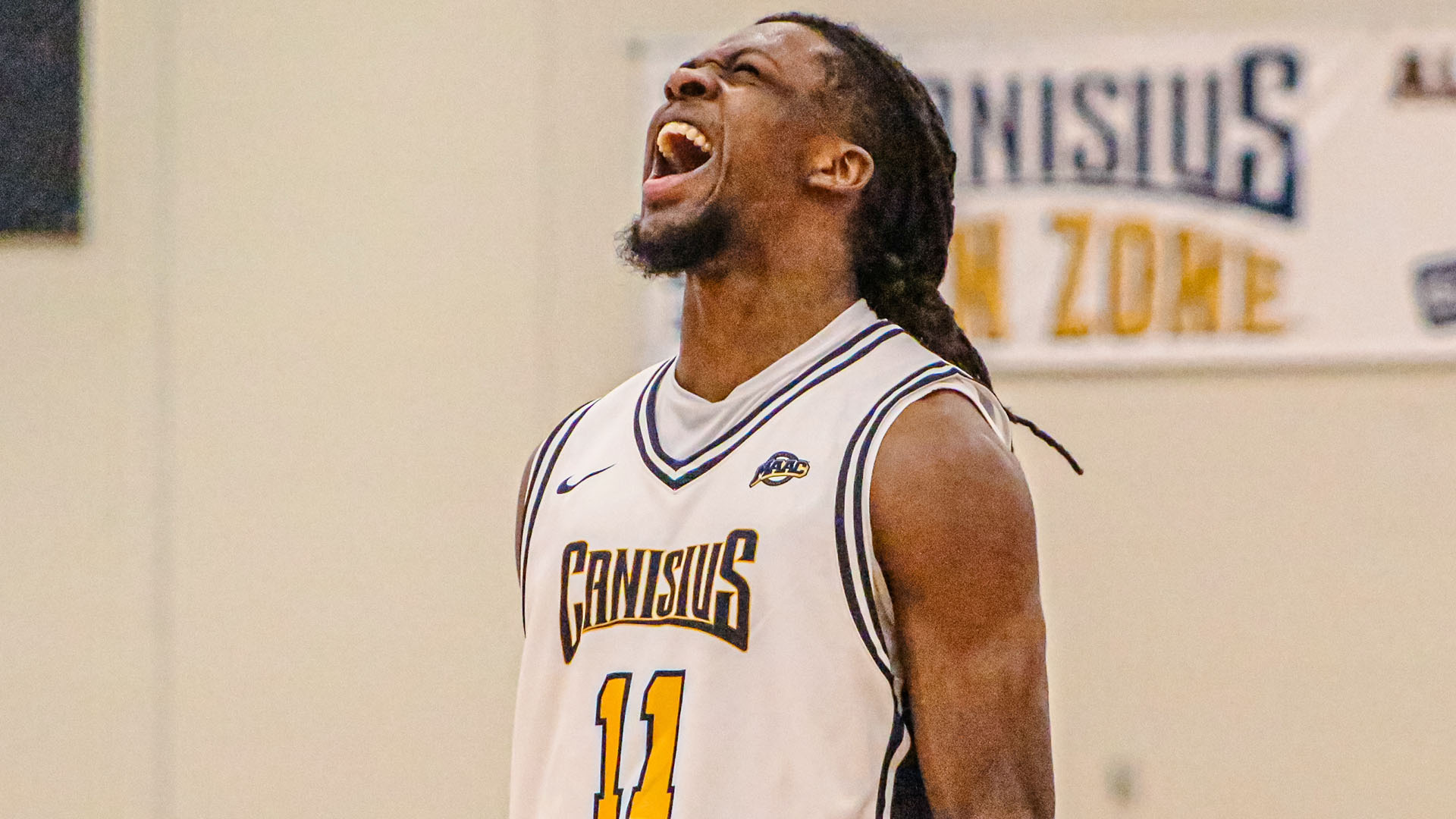 Kahlil Singleton celebrates after making a 3-pointer in a home win over Merrimack on Feb. 27, 2026.
