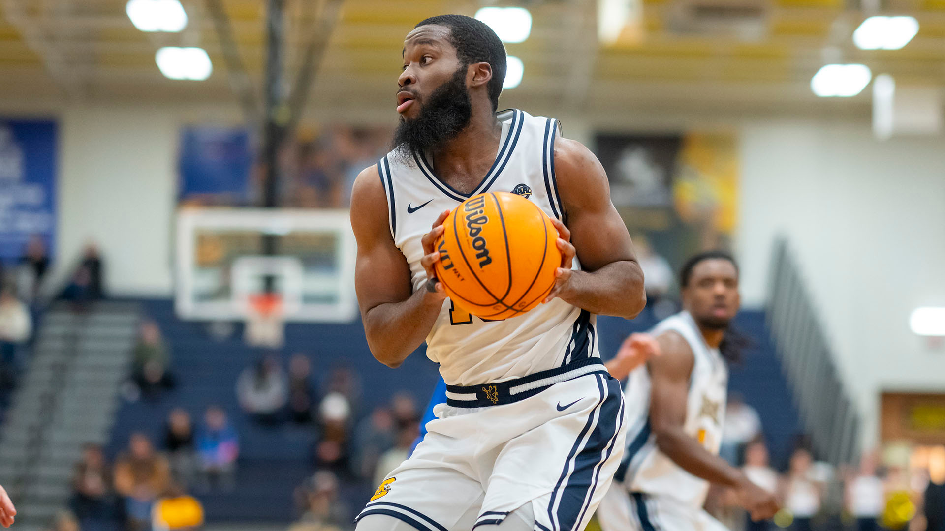 Mike Evbagharu looks to score from the baseline in a home game against Buffalo on Nov. 29, 2025.