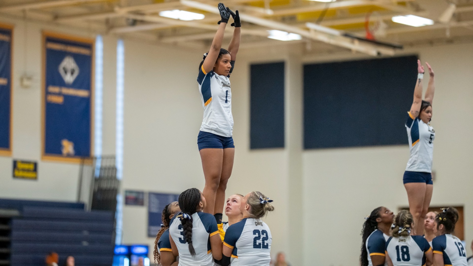 Aniyah Trippett held in the air by teammates at the Koessler Athletic Center in Buffalo, N.Y.