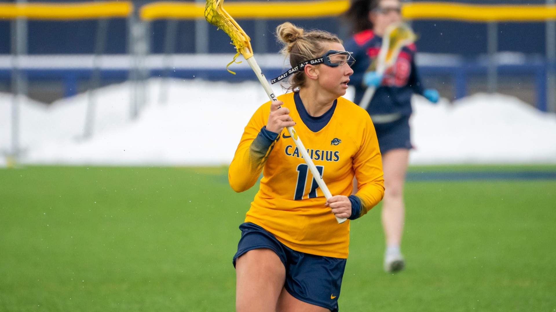 Megan Previdi cradles the ball against Detroit Mercy at the Demske Sports Complex in Buffalo, N.Y.