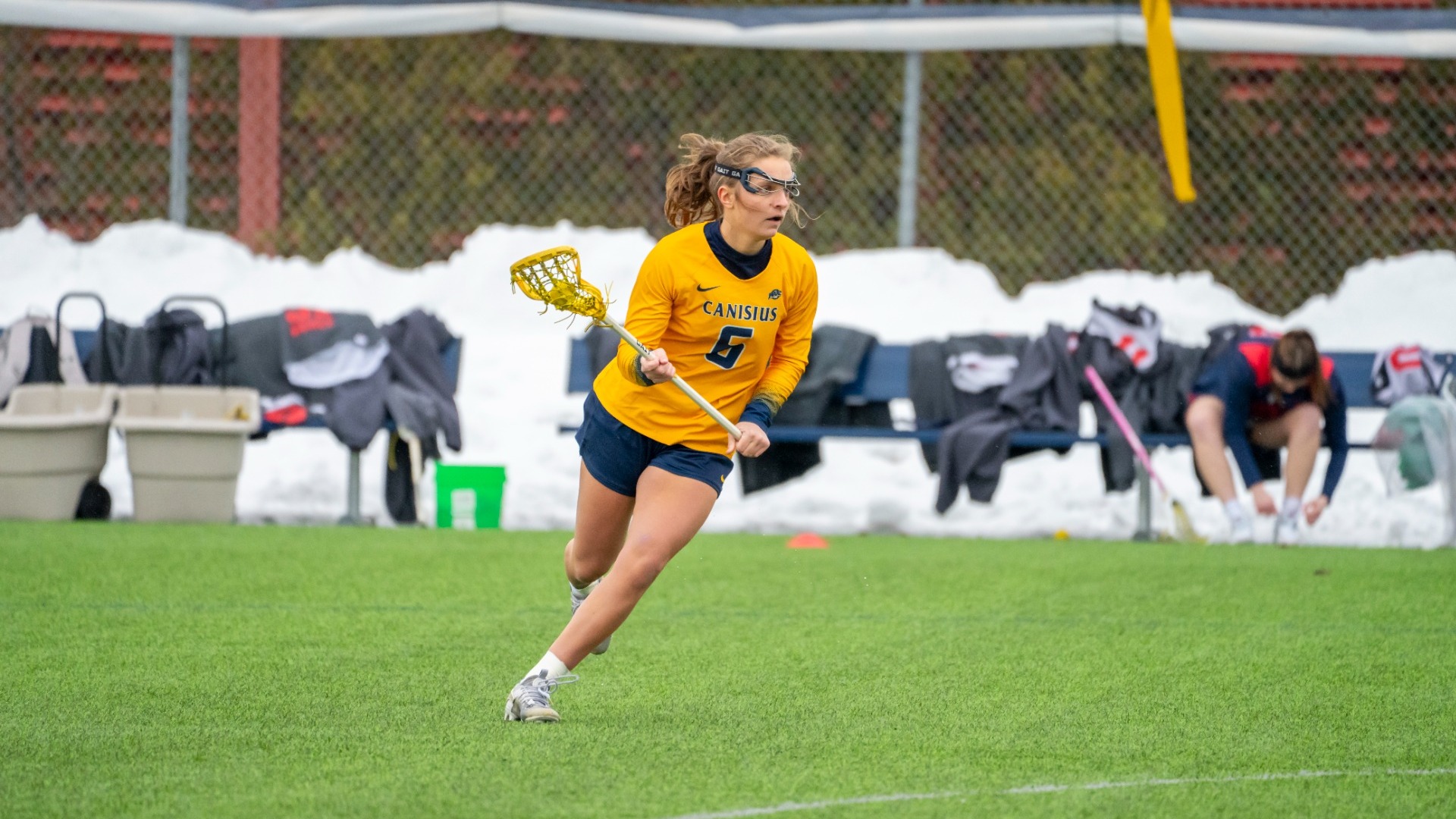 Maddie Fitzgerald cradles the ball down the field at the Demske Sports Complex.