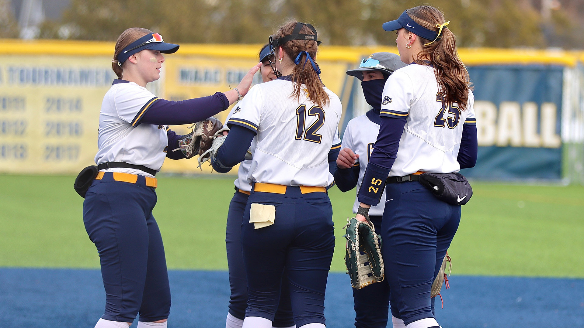 Members of the Canisius softball team meet in the circle prior to the start of an inning in a home game against Siena on March 24, 2026.