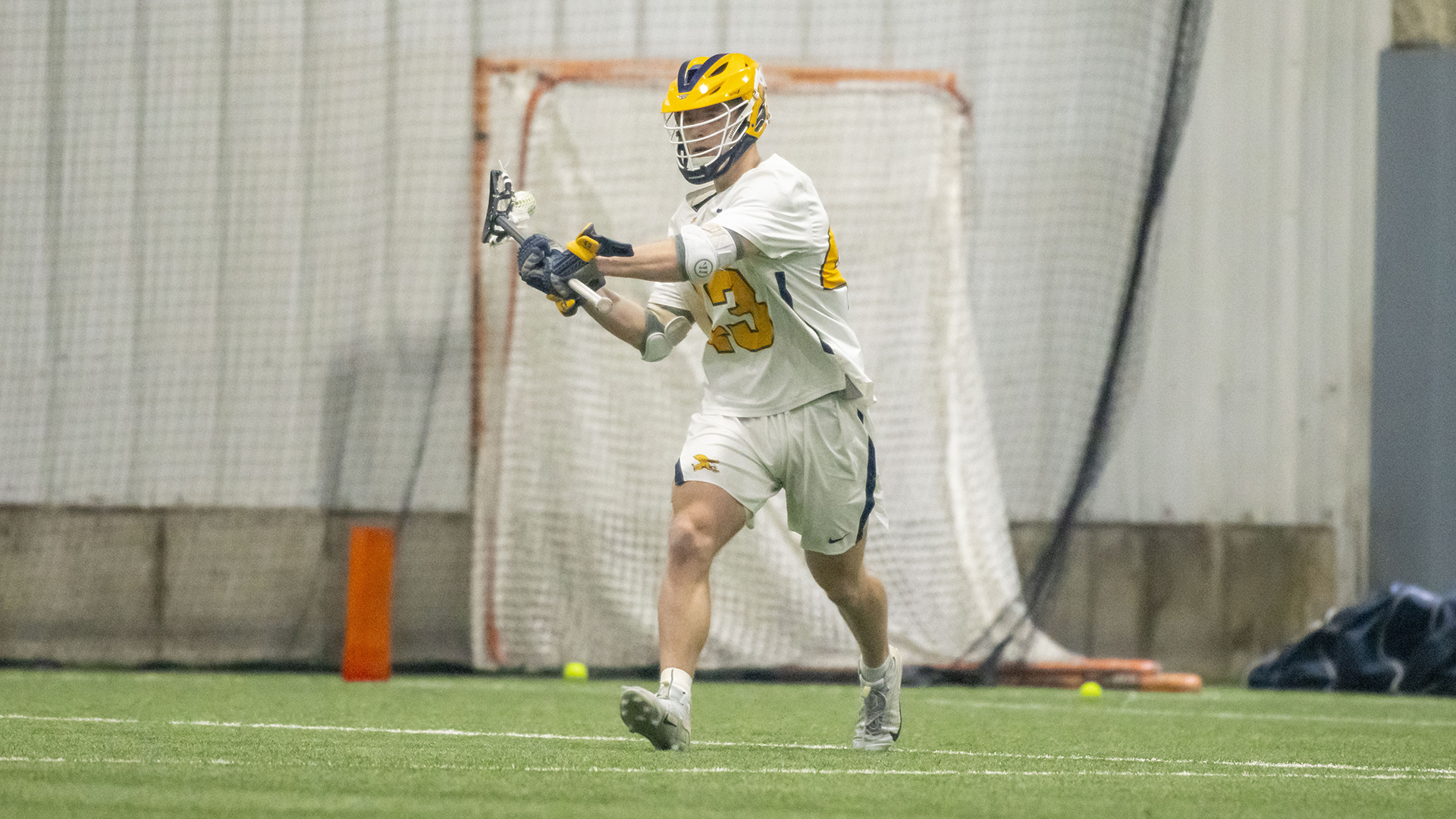 Canisius defenseman Ashton Burian is shown running with the ball during game action versus Le Moyne at Sahlen's Sports Park in Elma, N.Y. on Feb. 24, 2026