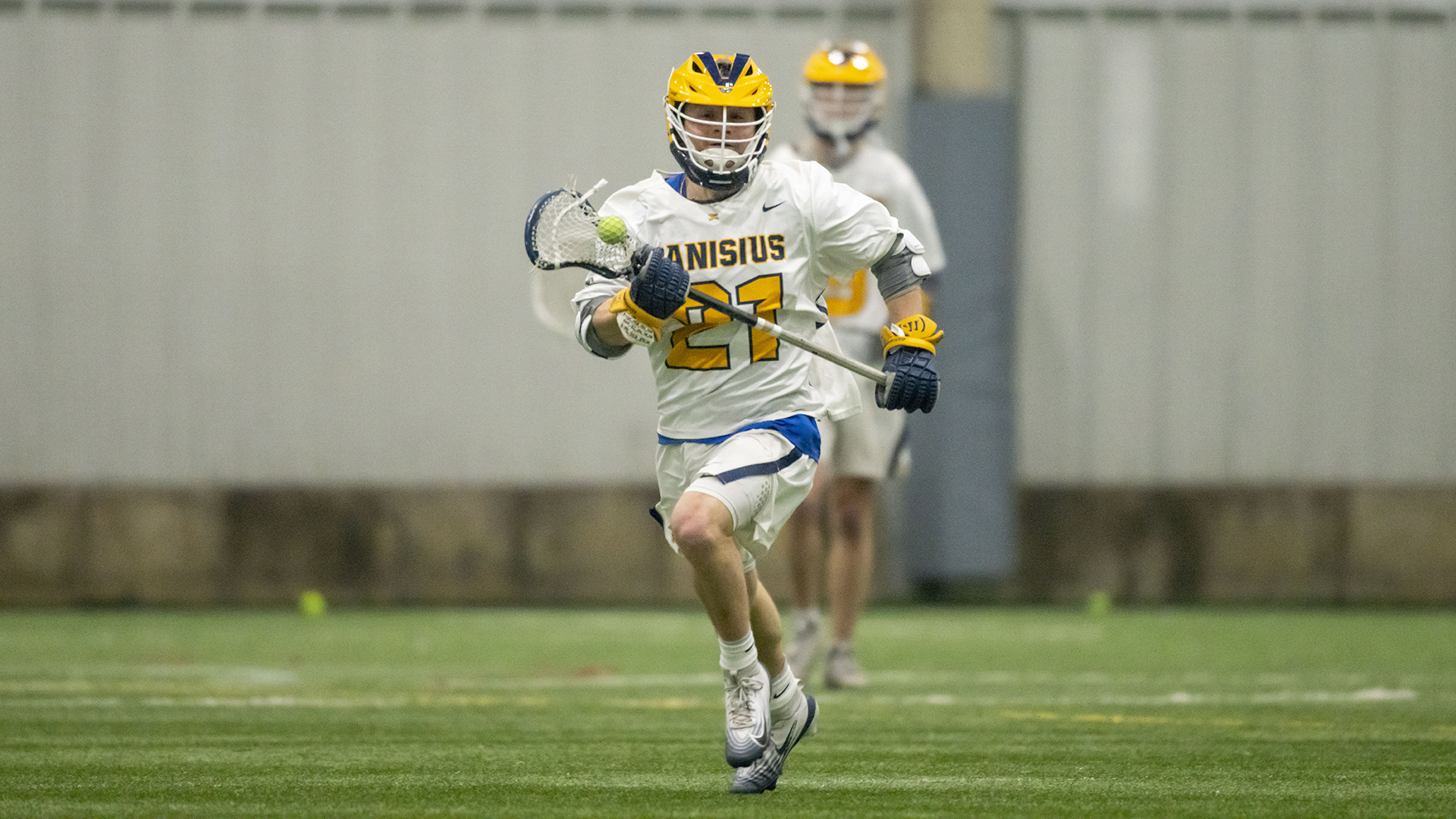 Canisius midfielder Dylan Collins is shown running with the ball during game action versus Le Moyne at Sahlen's Sports Park in Elma, N.Y. on Feb. 24, 2026