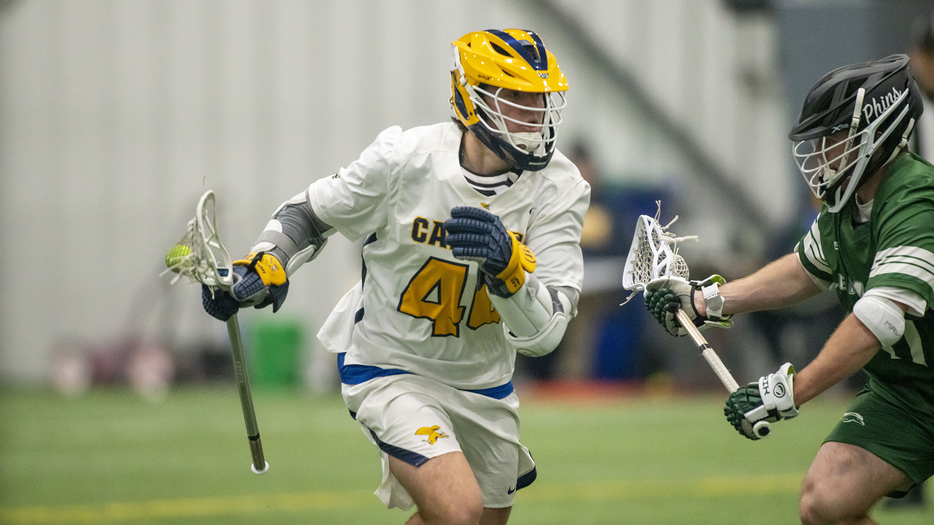 Canisius attackman/midfielder Justin Relosky passes the ball during game action versus Le Moyne at Sahlen's Sports Park in Elma, N.Y. on Feb. 24, 2026