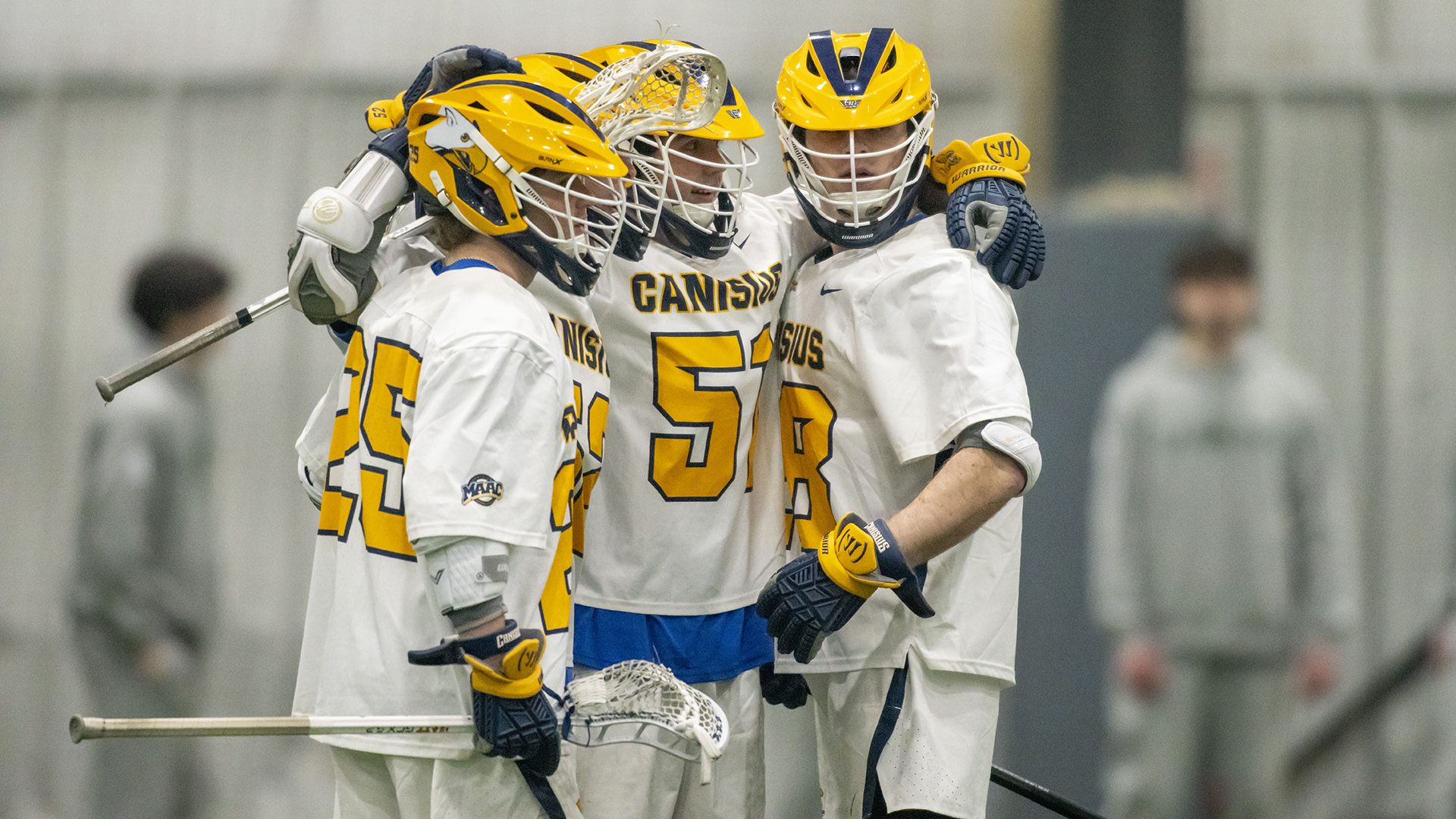Members of the Canisius men's lacrosse celebrate after scoring a goal against Le Moyne at Sahlen's Sports Park in Elma, N.Y. on Feb. 24, 2026