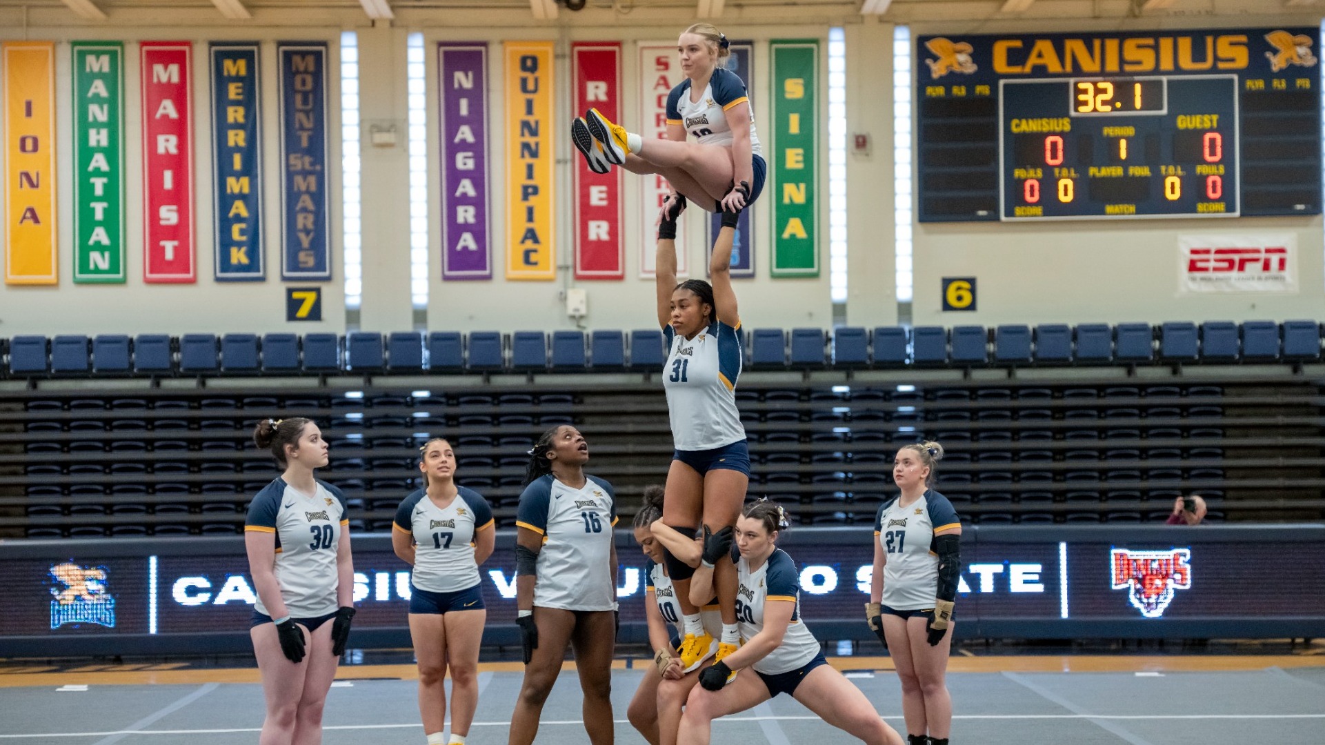 Orient sits on top of a pyramid in an acrobatics and Tumbling meet against Buffalo State.