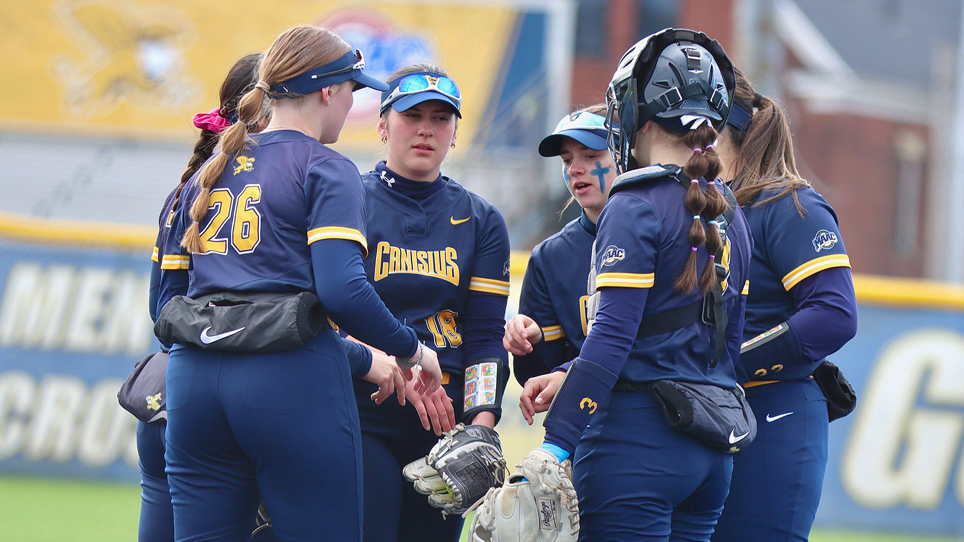 Members of the Canisius softball team meet in the circle prior to the start of an inning in a home game against Fairfield on March 29, 2026.