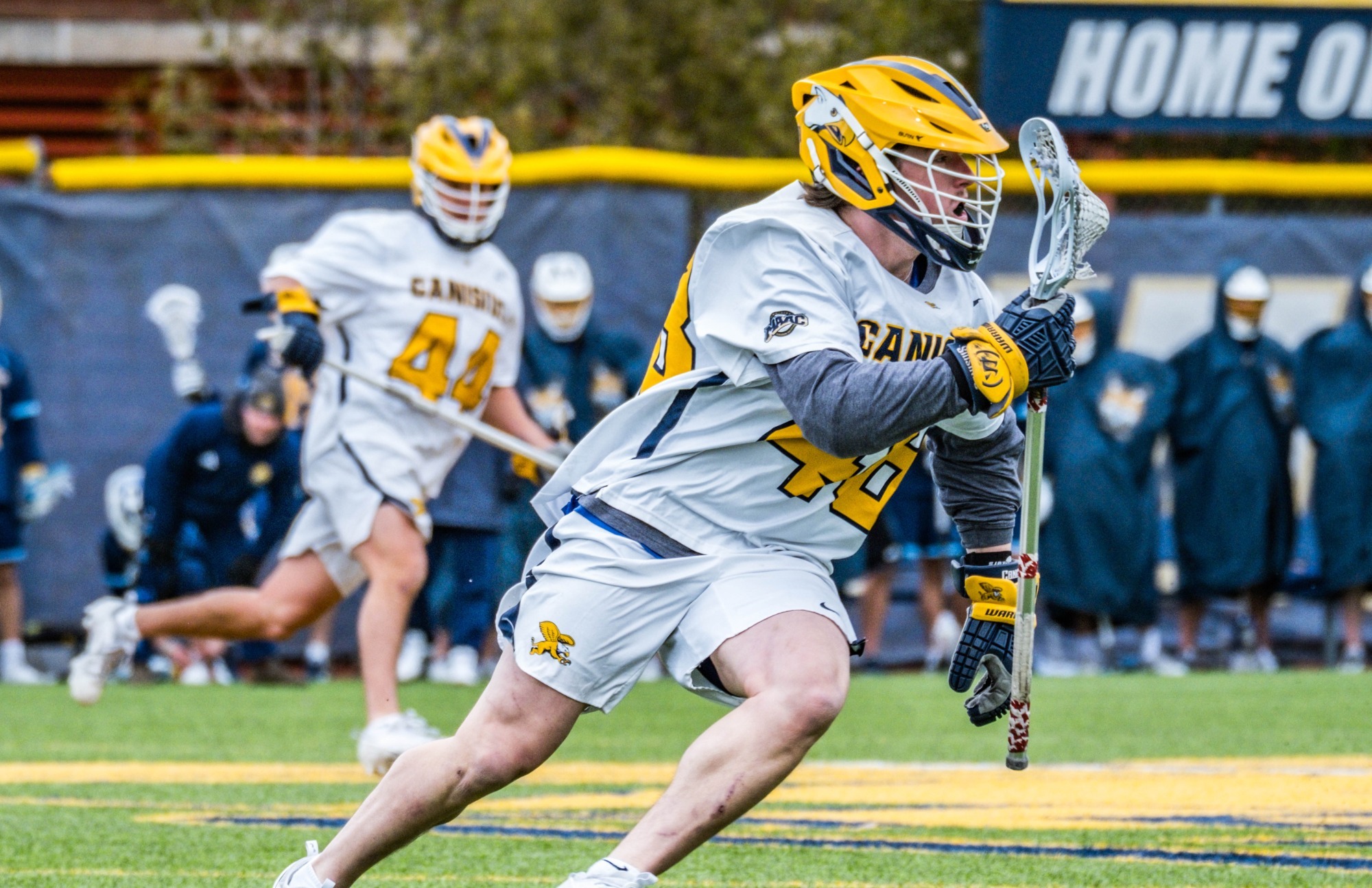 Canisius face-off specialist MIcah Hanson is shown running with the ball in game action versus Quinnipiac at the Demske Sports Complex on March 14, 2026